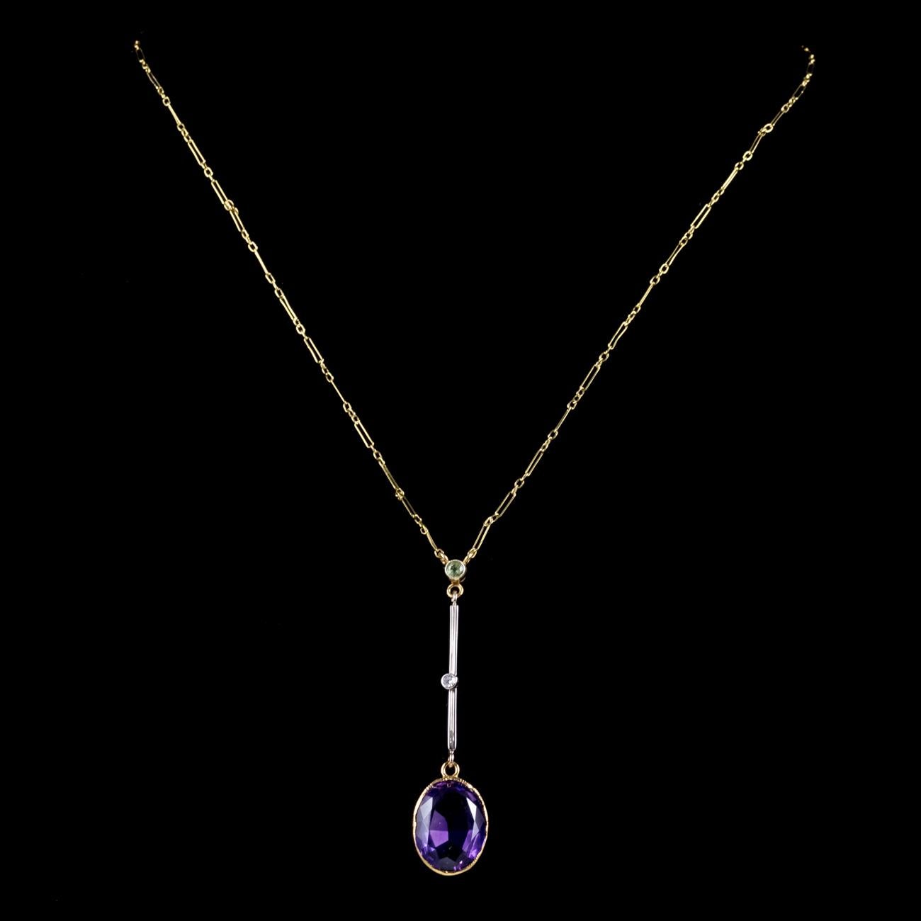 A beautiful antique Victorian Suffragette lavaliere necklace featuring a pendant set with a Peridot, Diamond and a large Amethyst dropper which is approx. 5.5ct. Suffragette jewellery was worn to show one’s allegiance to the women’s Suffragette
