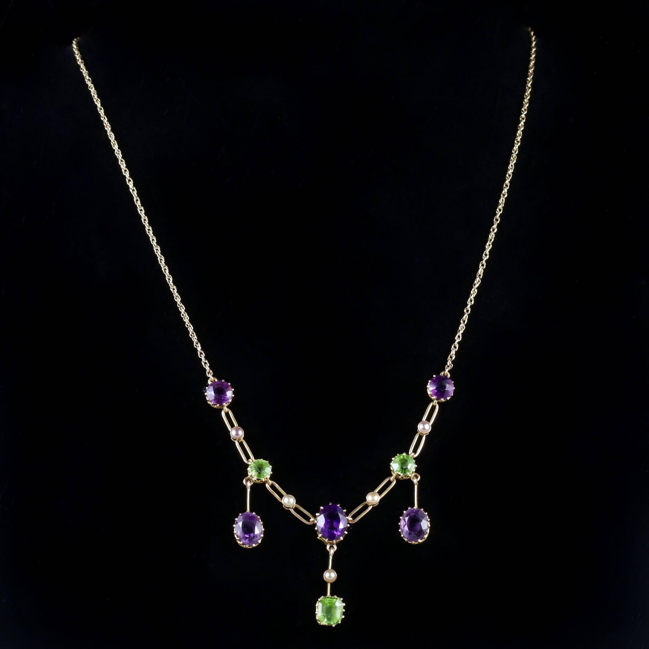 This spectacular Victorian suffragette necklace is set in 15ct and 9ct Gold, Circa 1900.

The necklace is all original and is adorned in large Amethysts, Peridots and Pearls.

The chain has a link effect with Pearls set into the gallery of the
