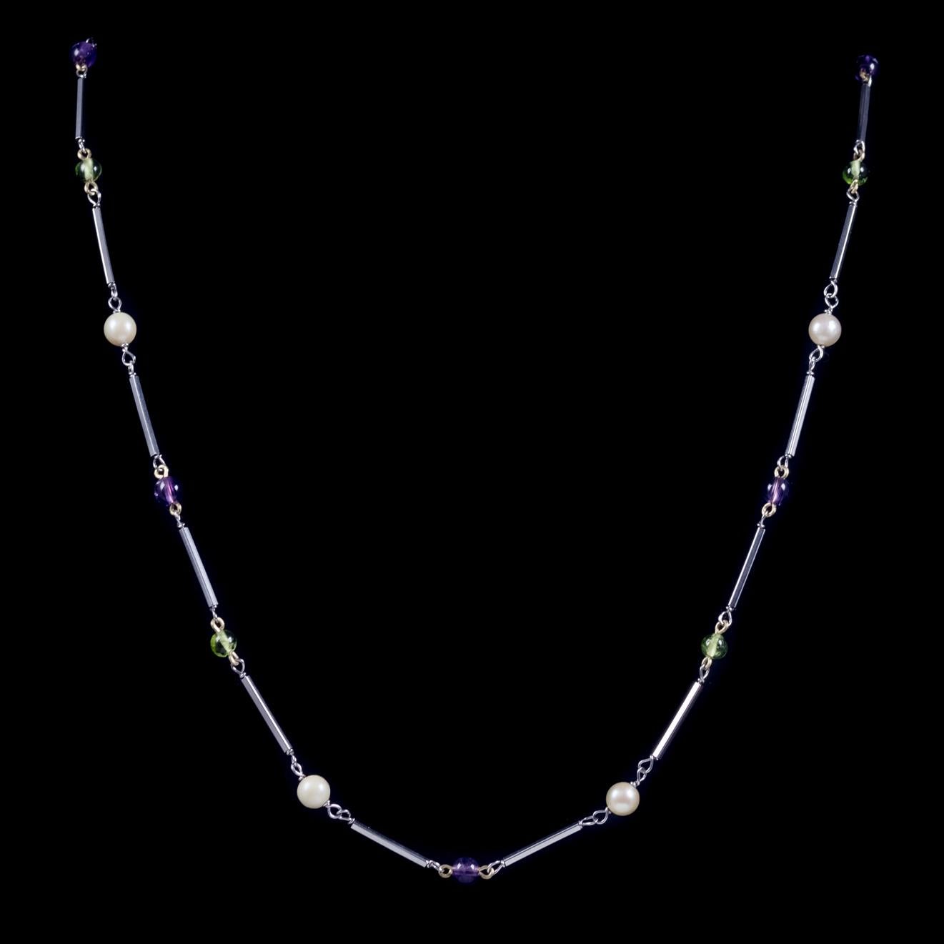 A beautiful antique Victorian Suffragette necklace C. 1900, adorned with green Peridot and violet Amethyst beads as well as creamy white Pearls. 

Suffragettes liked to be depicted as feminine, their jewellery popularly consisted of Violet, Green