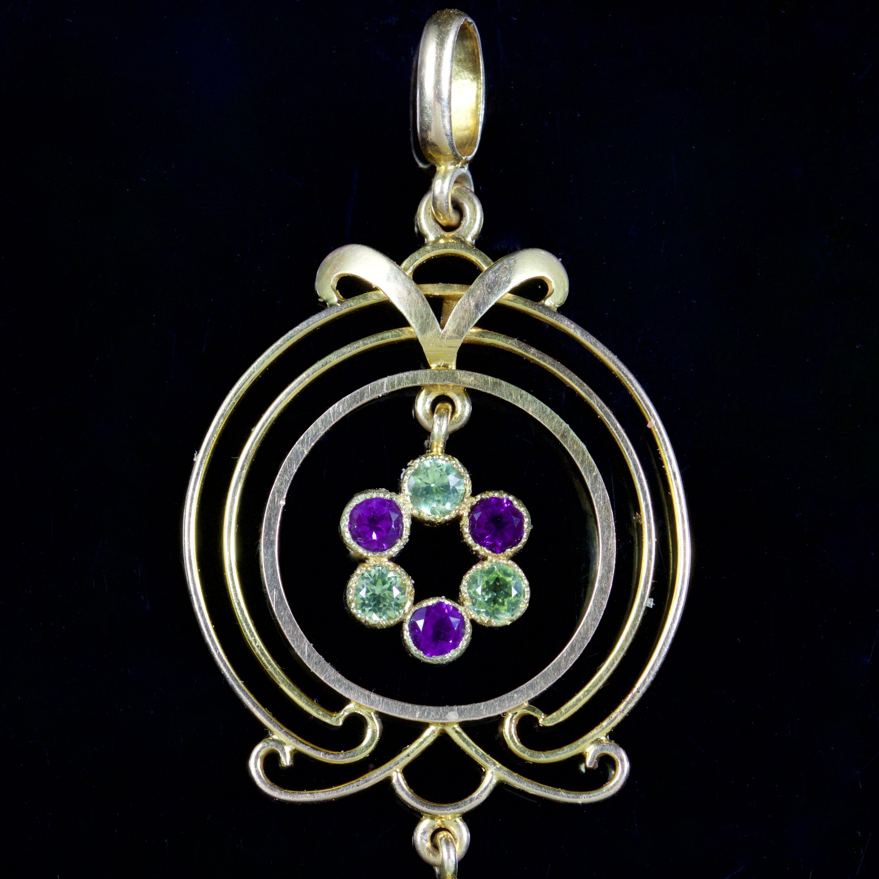 This beautiful Victorian Suffragette pendant is set in 15ct Gold, Circa 1900.

The pendant boasts a wonderful design, a cluster of Amethyst’s and Peridots hang freely in the 15ct Gold gallery.

A Pearl and Amethyst can be seen on the dropper
