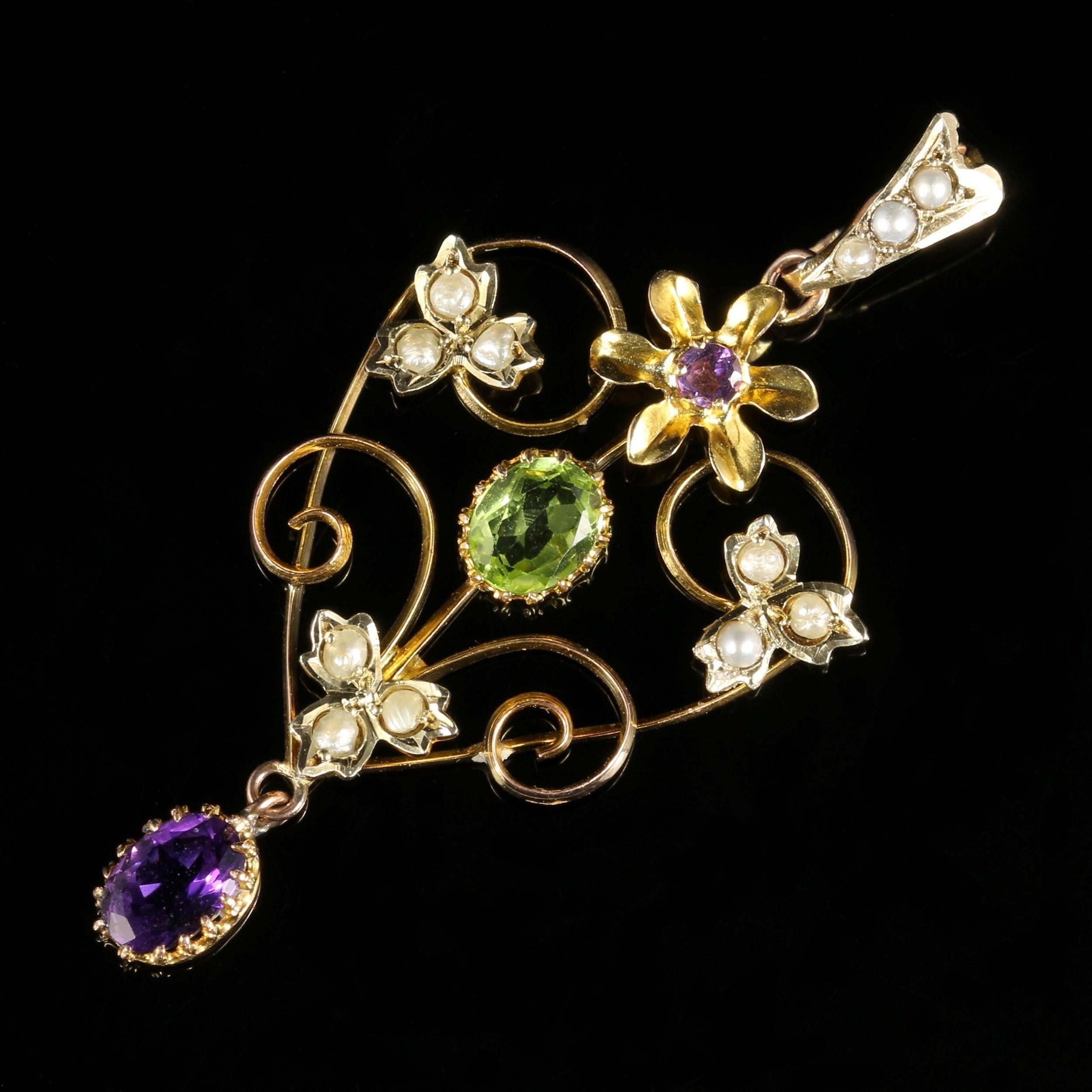For more details please click continue reading down below...

This fabulous antique 9ct Yellow Gold Suffragette Pendant is genuine Victorian, Circa 1900. 

The beautiful pendant is adorned with a central green Peridot and Violet Amethyst dropper,