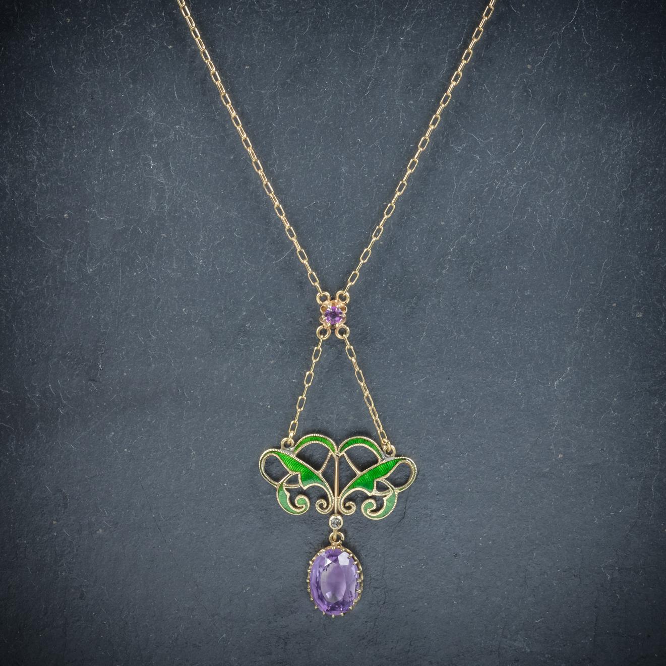 This beautiful antique Victorian pendant necklace was made representing the Suffragette movement, Circa 1900

The pendant and chain are set in 15ct Yellow Gold with pretty green Enamel colouring across the gallery

The drop pendant is also adorned