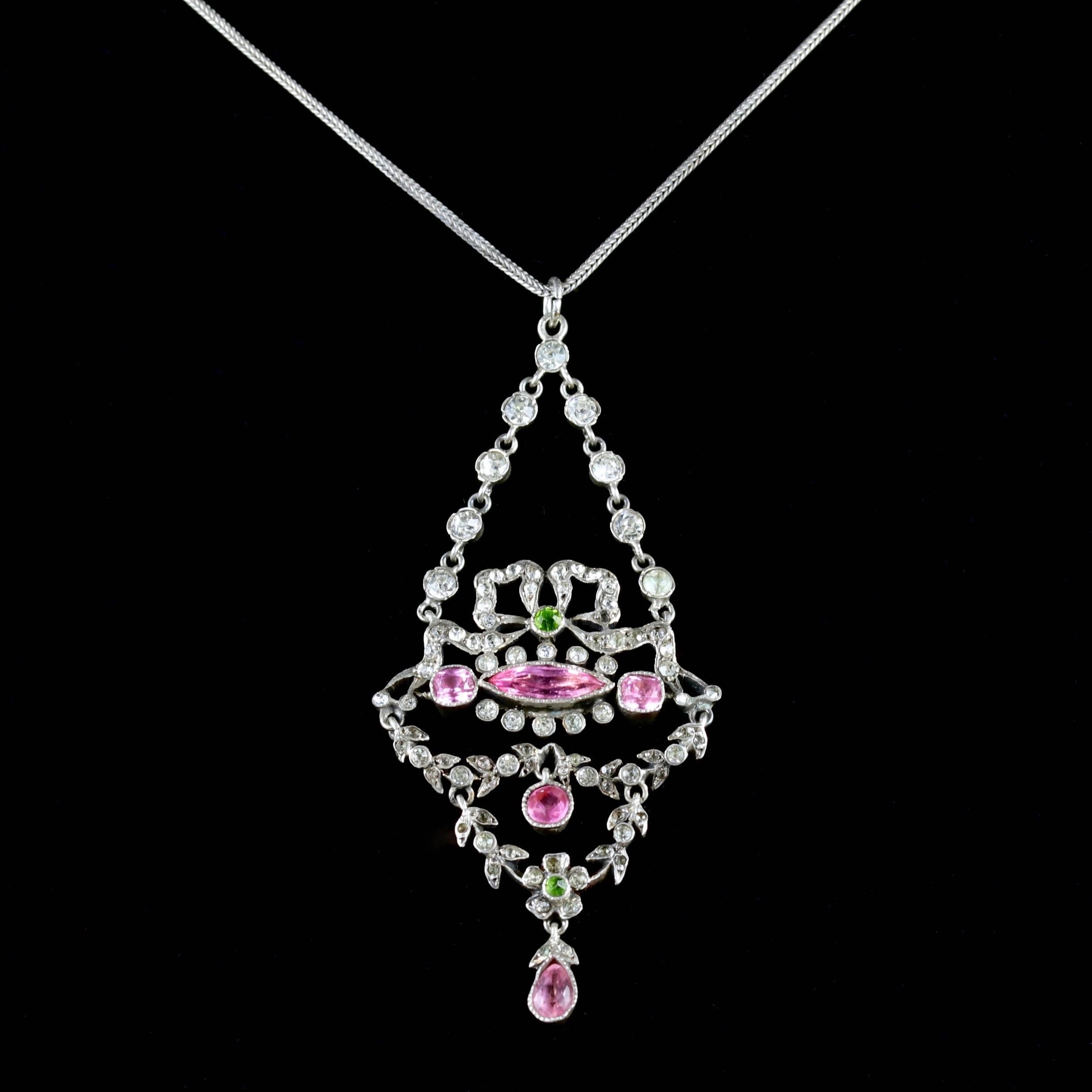 This fabulous Suffragette Victorian pendant necklace is set in Sterling Silver, Circa 1905.

The pendant is adorned in sparkling white, pink and green Paste Stones that represent the Suffragette movement.

Suffragettes liked to be depicted as