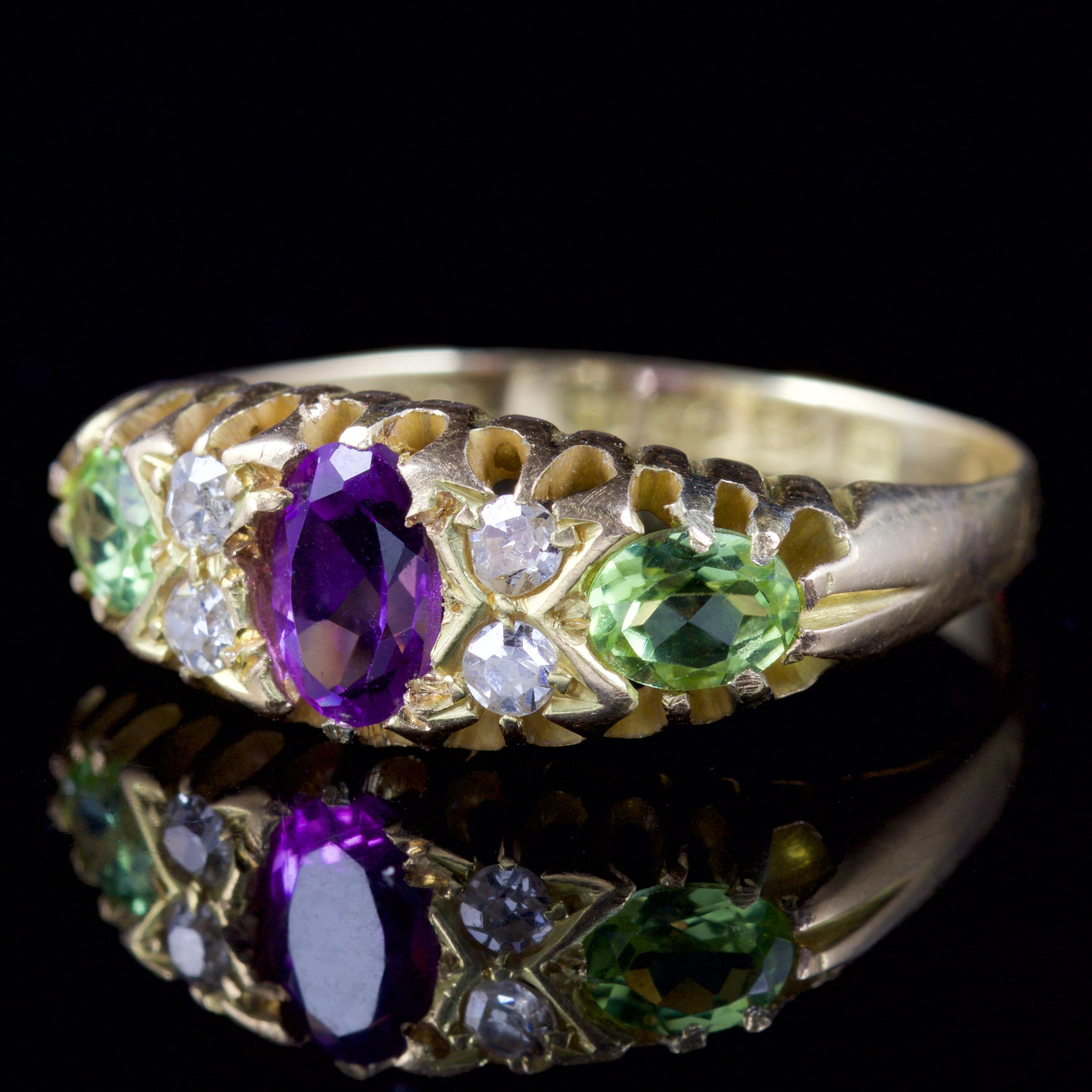 This marvellous Victorian 18ct Yellow Gold Suffragette ring is dated, Chester 1915.

The ring boasts craftsmanship, it is beautifully decorated in an Amethyst, two Peridots and sparkling Diamonds which are nestled in-between them gemstones.

The