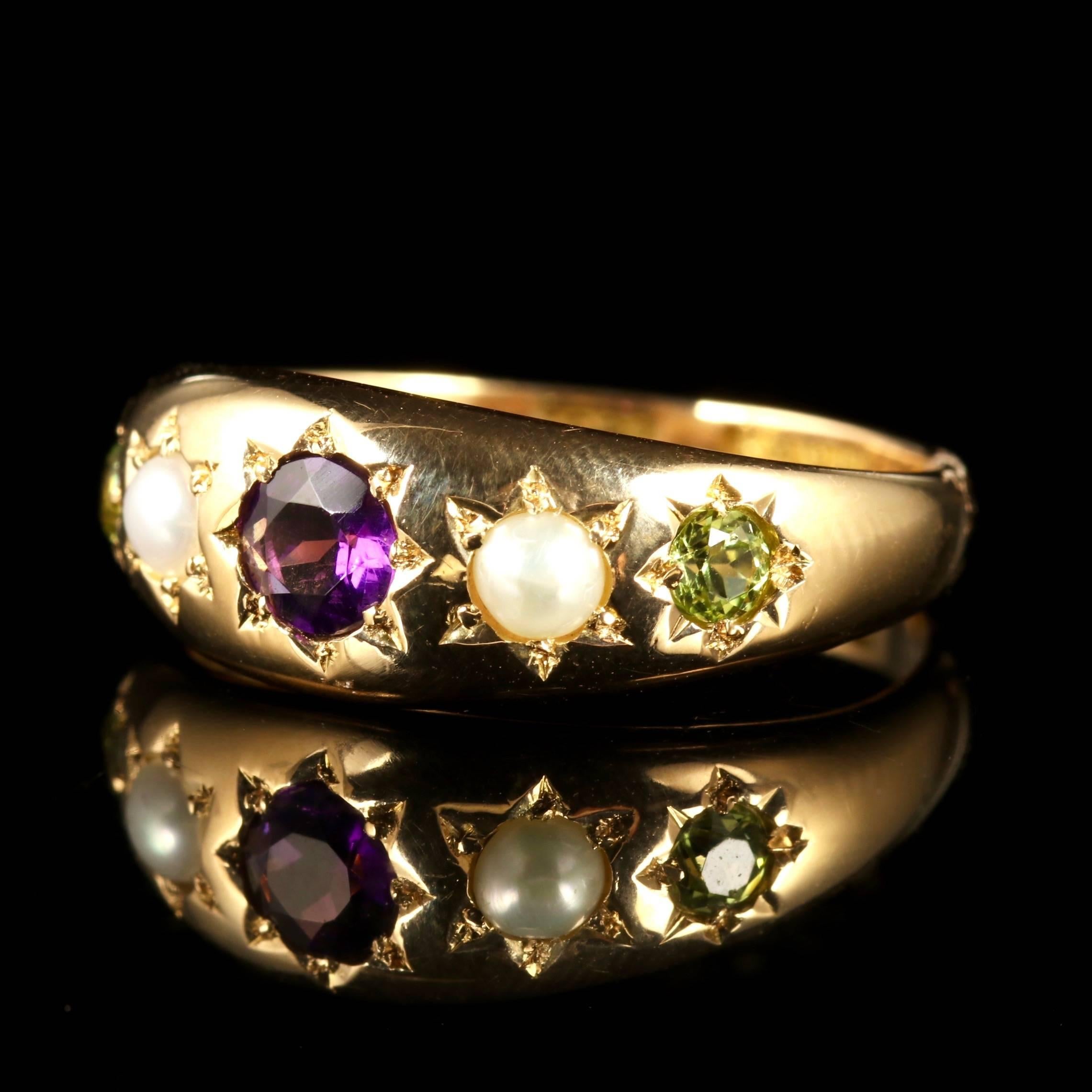 This fabulous 18ct Yellow Gold Victorian Suffragette gypsy set ring is Circa 1900.

The ring is adorned with a central Amethyst, which has two creamy Pearls and also two Peridots at either side.

Suffragettes liked to be depicted as feminine, their