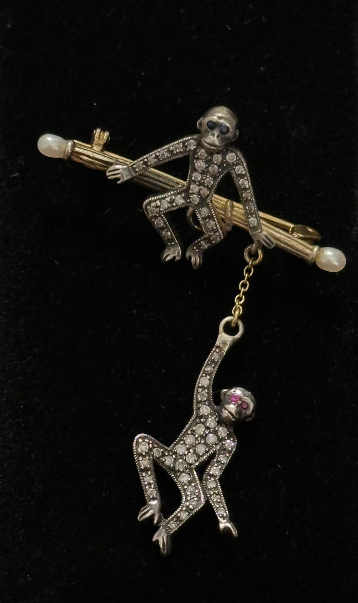 Antique Victorian Swinging Monkey Brooch with Rose Cut Diamonds, Sapphires, Rubies, and River Pearls, Circa 1880-1900

This antique Victorian swinging monkey brooch, dating from the late Victorian era (circa 1880-1900), is a stunning example of