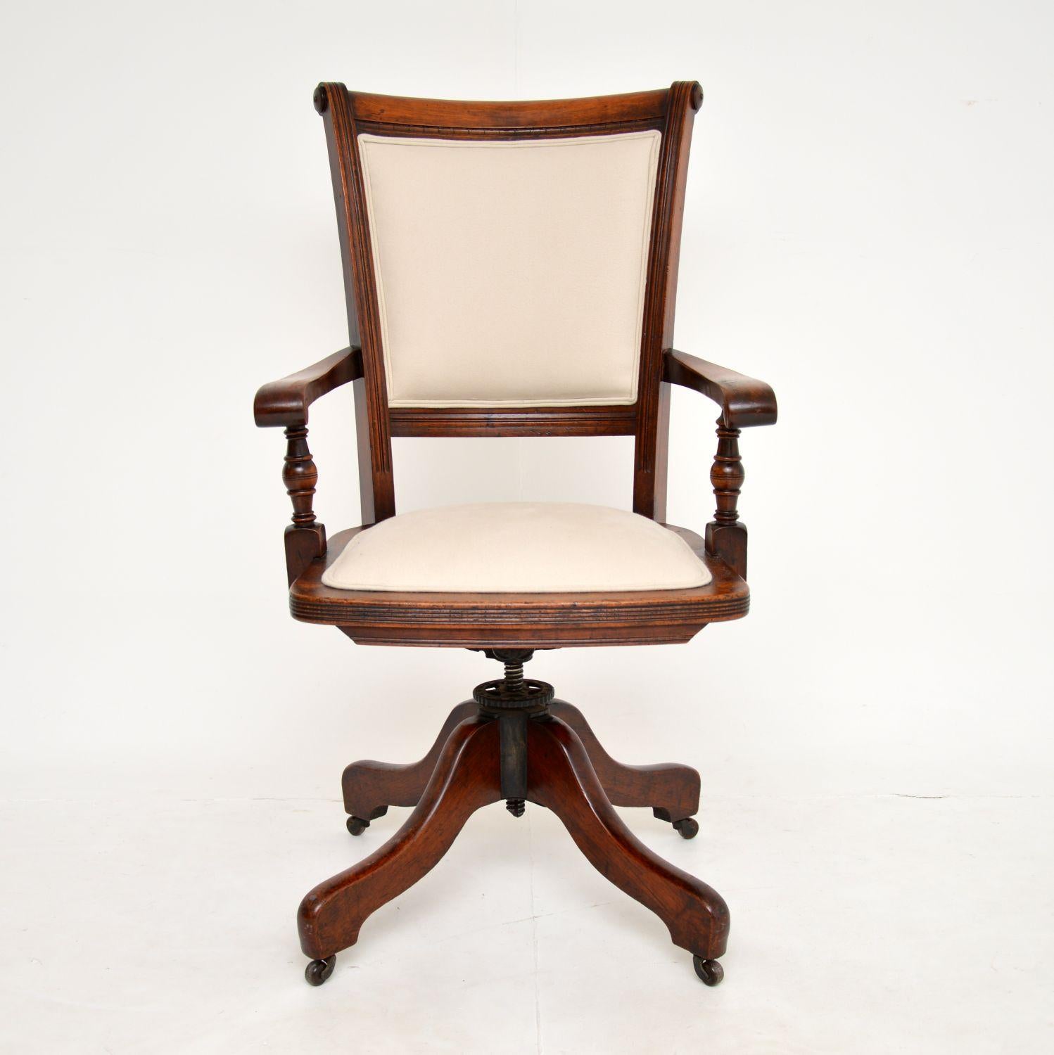 An excellent antique Victorian period swivel desk chair in wood. This was made in England, it dates from around 1880-1900 period.

This is very well made and is very comfortable. It swivels smoothly, rolls on casters and tilts, the height is also