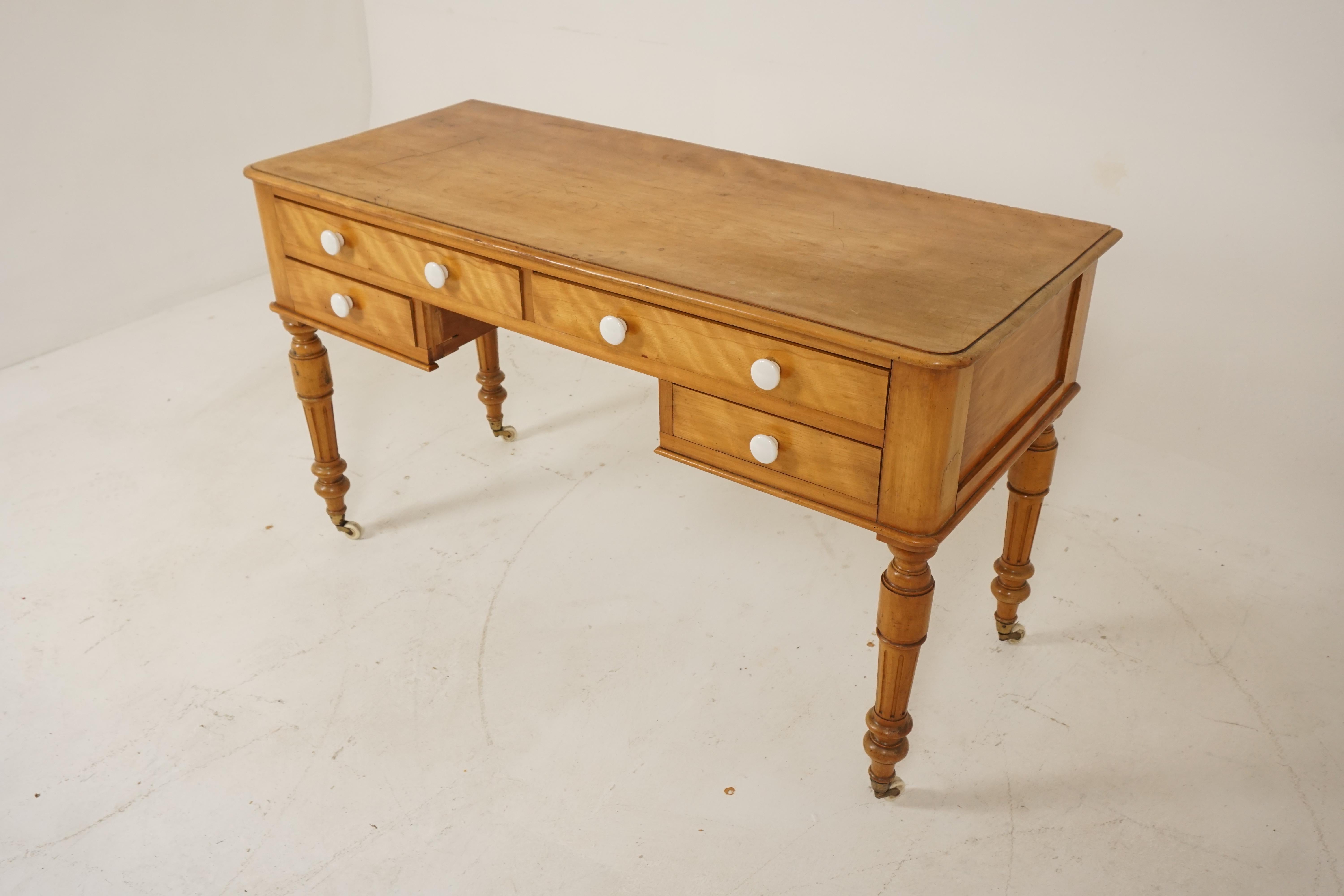 Antique Victorian Table, Satin Birch, Writing Desk, Scotland 1880s, H206

Scotland 1880s
Satin birch
Original finish
Rectangular moulded top
Pair of two long and two short dovetailed drawers with porcelain knobs
All standing on fluted legs with