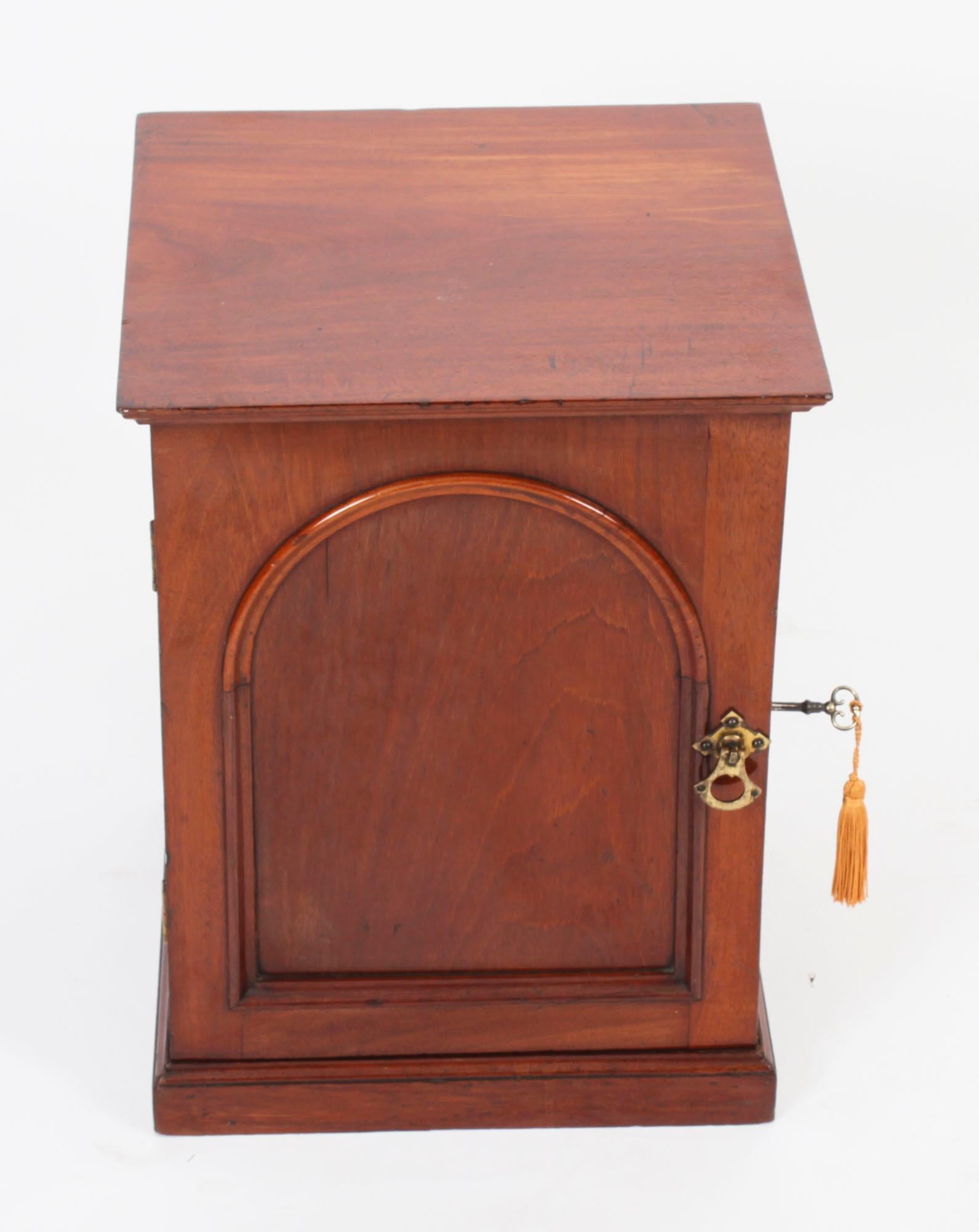 This is a elegant Victorian mahogany table top jewellery collectors cabinet, circa 1840 in date.
 
The cabinet is freestanding, finished all round, and features a paneled door, enclosing three drawers on a plinth base. The top drawer feature a