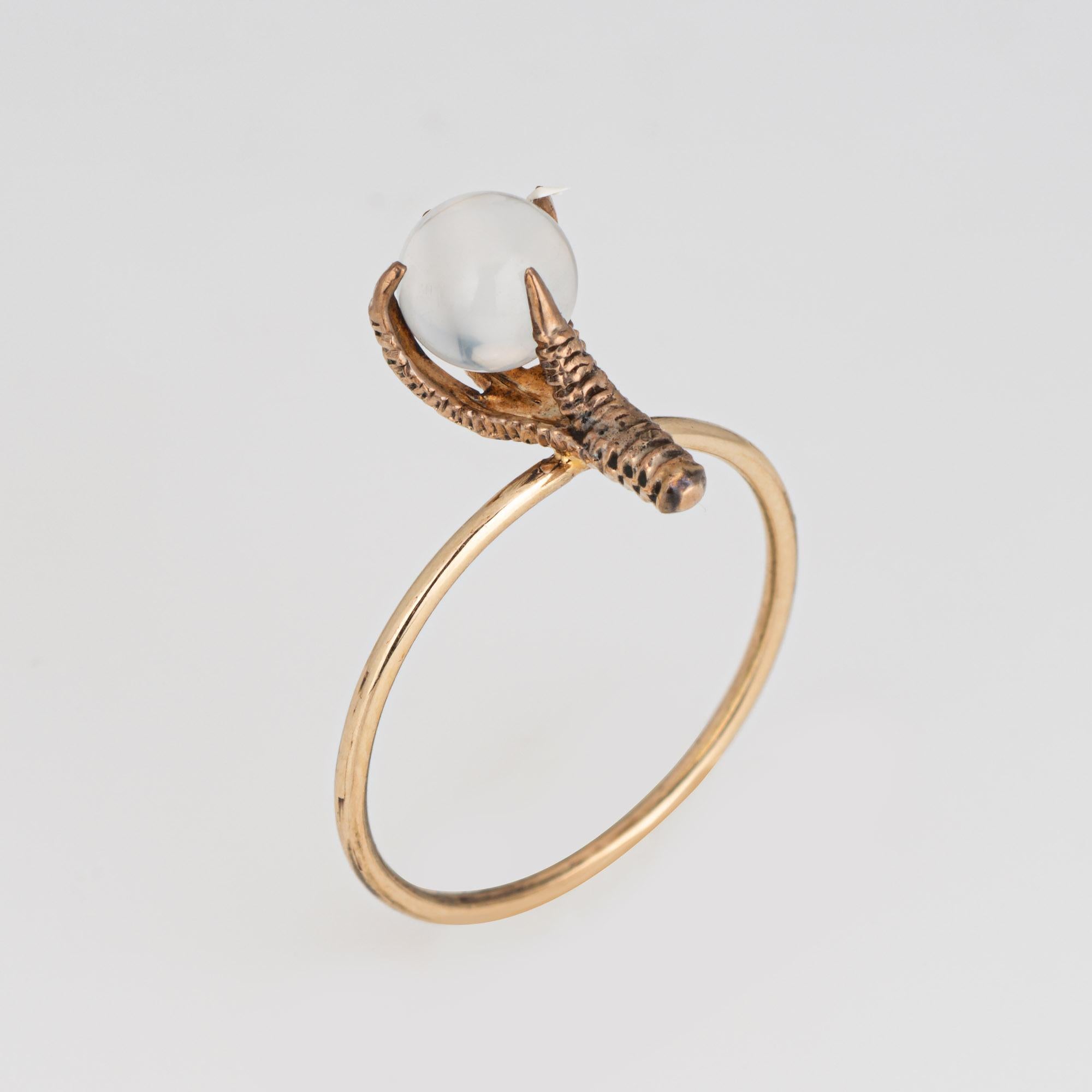 Originally an antique Victorian era stick pin (circa 1880s to 1900s), the moonstone talon ring is crafted in 14 karat rose gold.

The ring is mounted with the original stick pin. Our jeweler rounded the stick pin into a slim band for the finger. The
