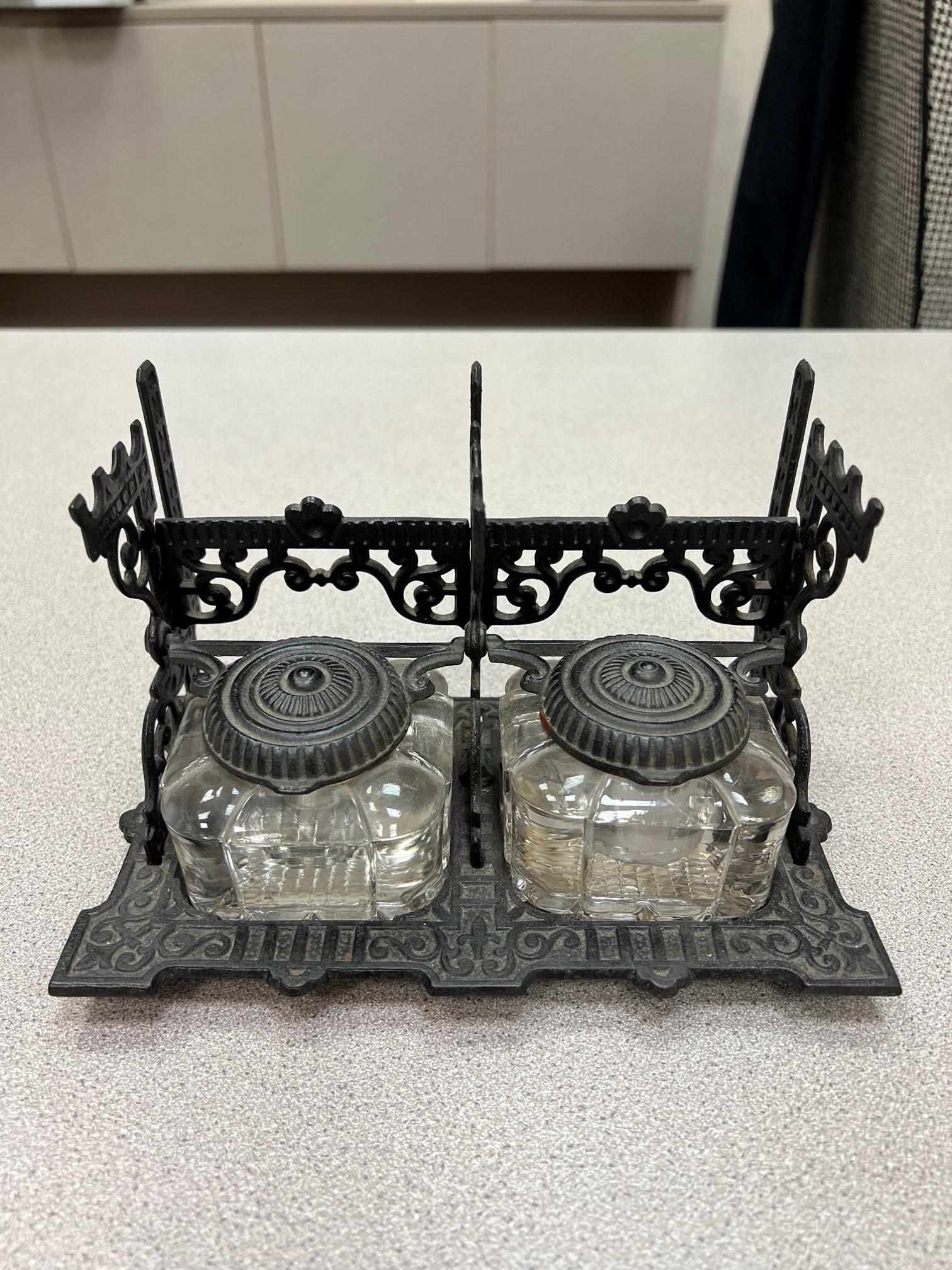 Hard to find antique Victorian Tatum's dual postal inkwell stand with two crystal inkwells in a decorative iron stand with hinged lids and three pen quail rests. The inkwell is signed Tatum's Postal Ink Stand and is in very good condition, a nice