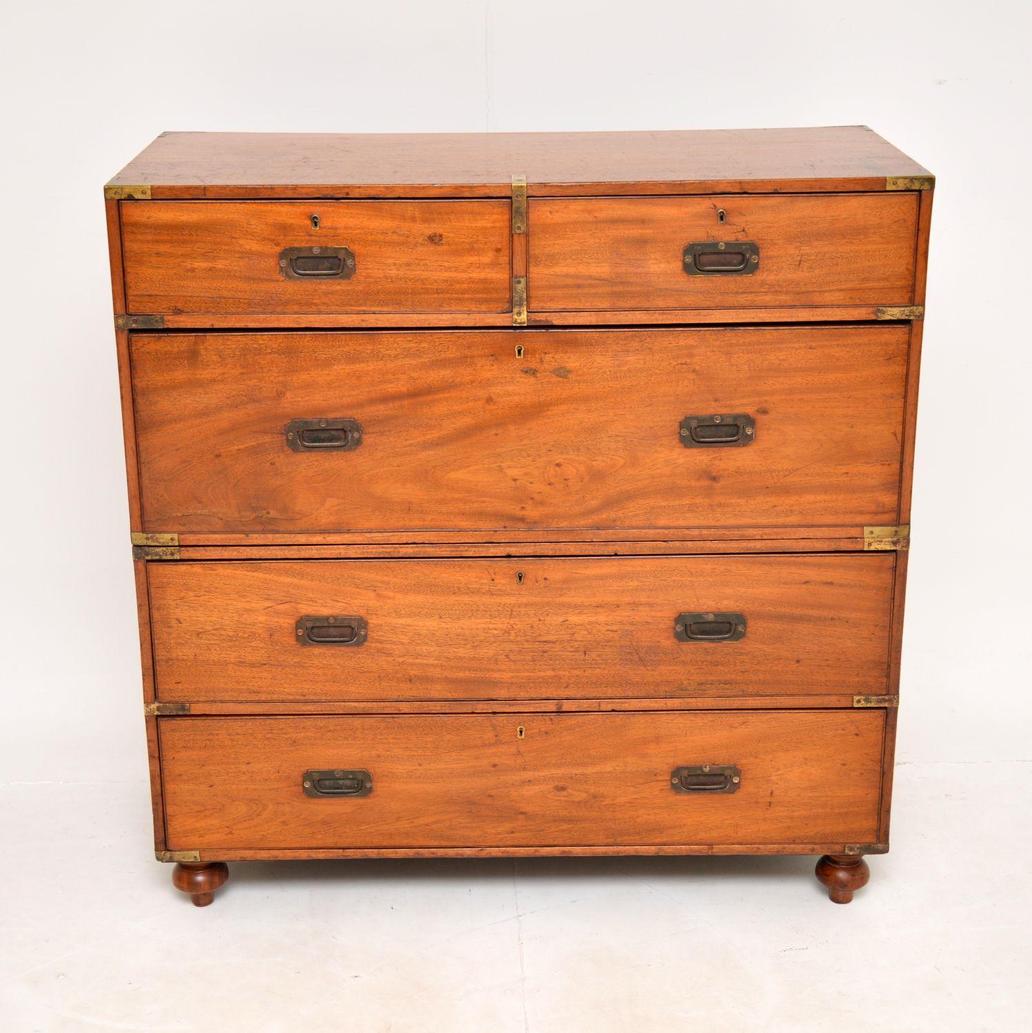 An excellent original antique Victorian military campaign chest of drawers in teak. This was made in England, it dates from around the 1860-70’s.
It is a great size and is a very useful item. It comes apart in two main pieces, with brass carry