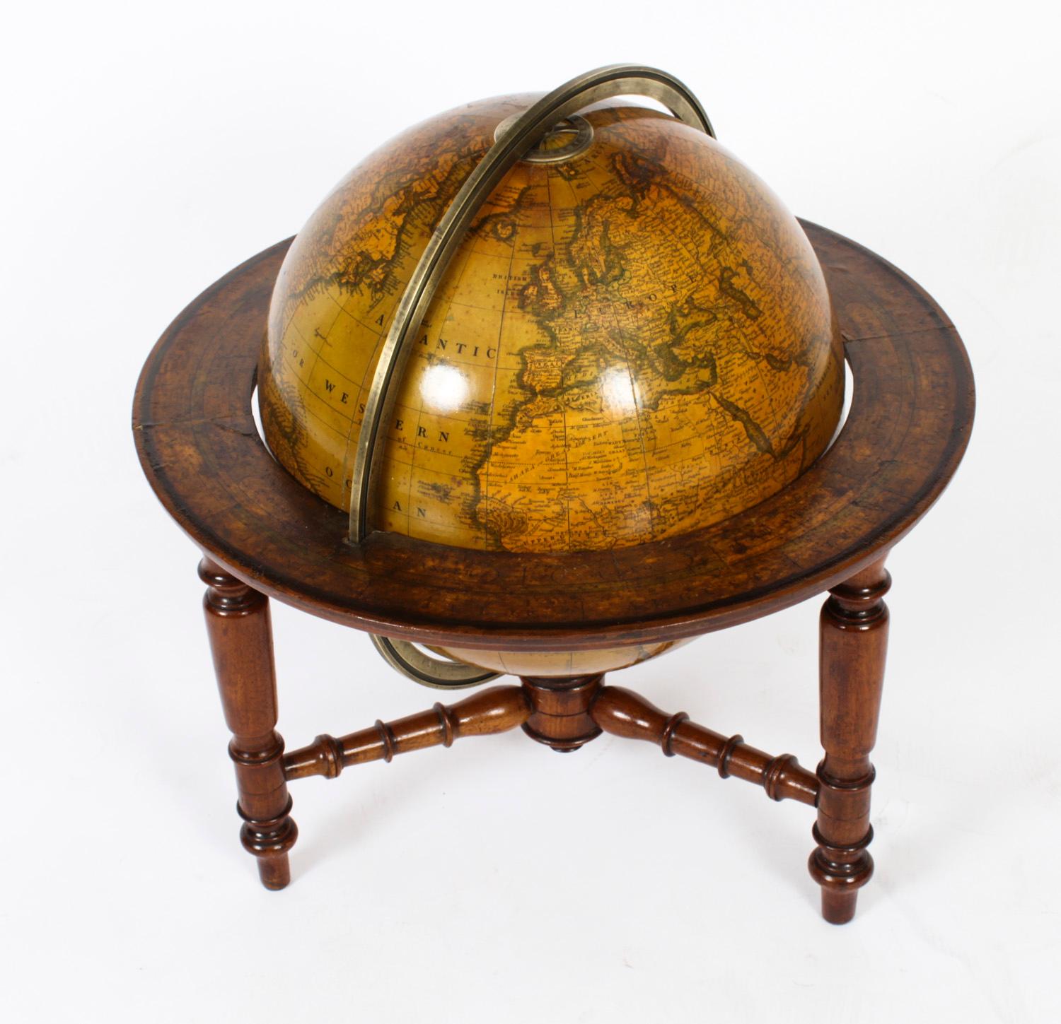 A fine antique Victorian terrestrial 'Cruchley's Late Cary's New Terrestrial' 12-inch table globe, dated 1855.
 
The globe is fitted with a brass meridian ring, a horizon ring with printed months of the year and astrological signs, mounted on a