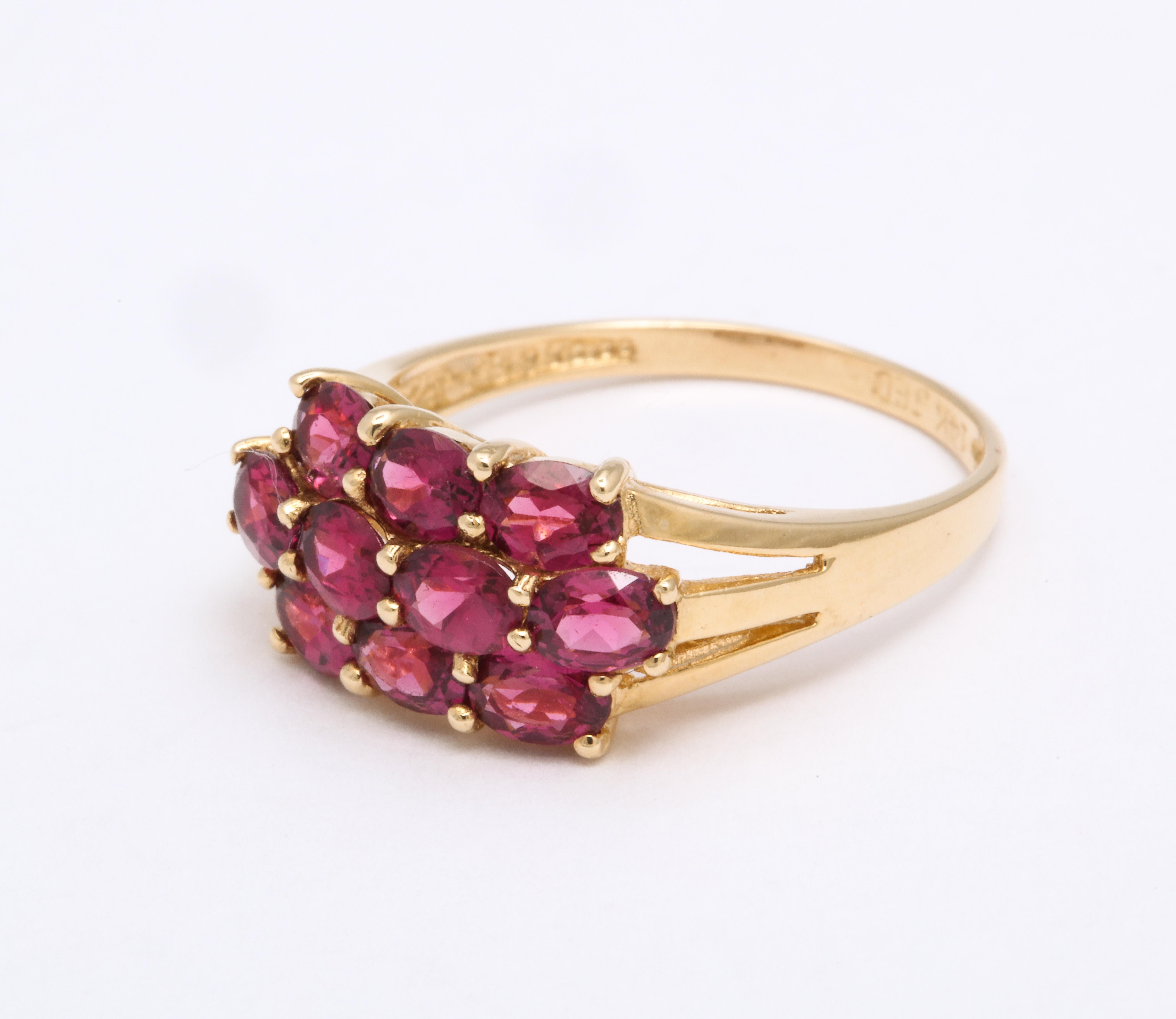 A victorian garnet ring with brilliant, sparkling cherry color and a pink under glow that the pictures do not capture. I consider reshooting the photographs. Made in c.1890, the ring is American made in 14 Kt gold. Garnet was a popular stone in the