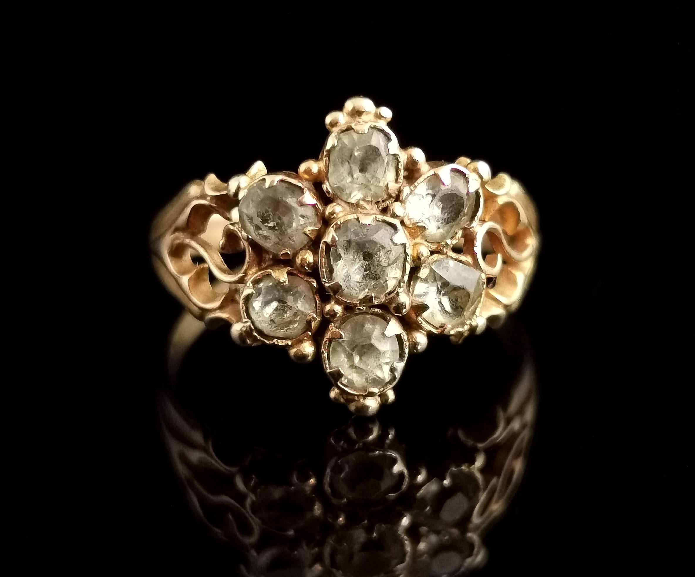 A stunning antique early Victorian era Topaz cluster ring in 18 karat yellow gold.

A very pretty ring with a central floral design cluster of light green oval and round cut Topaz, claw set to the beautiful rich 18kt yellow gold setting.

The