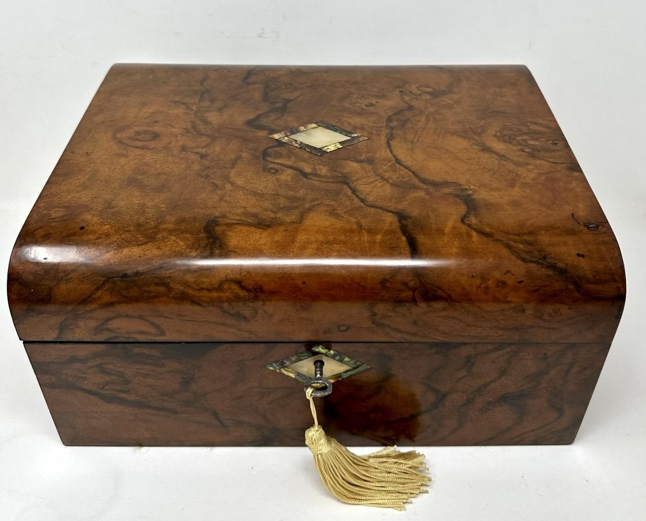 An exceptionally fine quality early English Well Figured Solid grained Burr Burl Walnut Ladies or Gents Travelling Writing Slope of outstanding quality and compact proportions. Last quarter of the Nineteenth Century. 

The hinged lid opening to