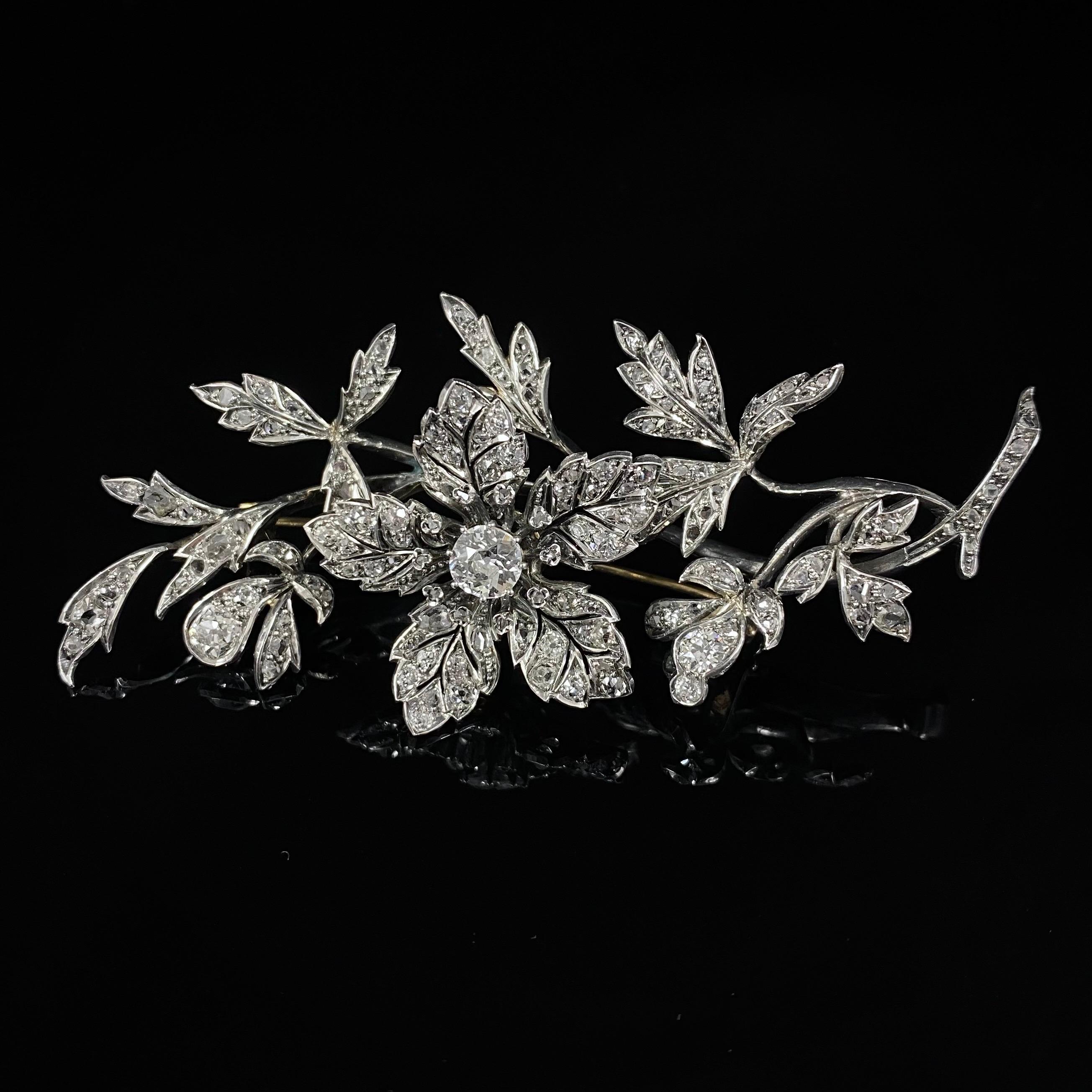 Victorian en Tremblant diamond floral spray brooch in silver and gold, Portugal, late 1800s. A dramatic Portuguese jewel from the second half of the 19th century, modelled as a floral and foliate spray composed by a central flowerhead mounted “en