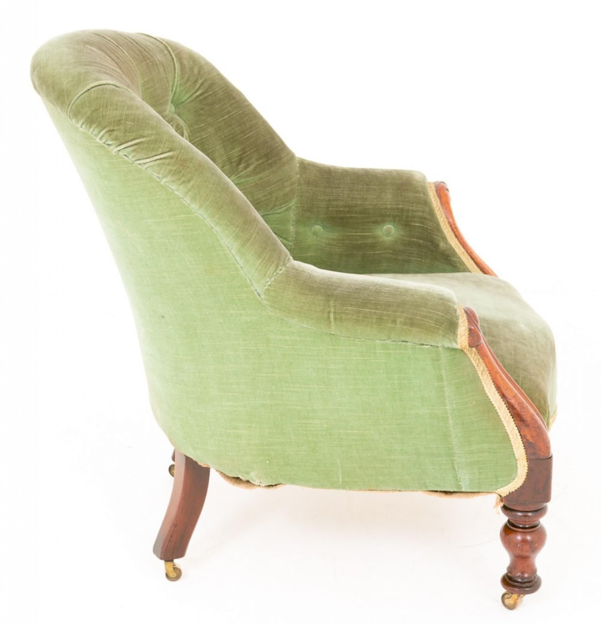 Victorian Mahogany Tub Chair. Having ring turned legs with brass castors.
This chair has swept and carved uprights and is currently covered in a deep buttoned green dralon.
circa 1870
A very pretty and comfortable chair.