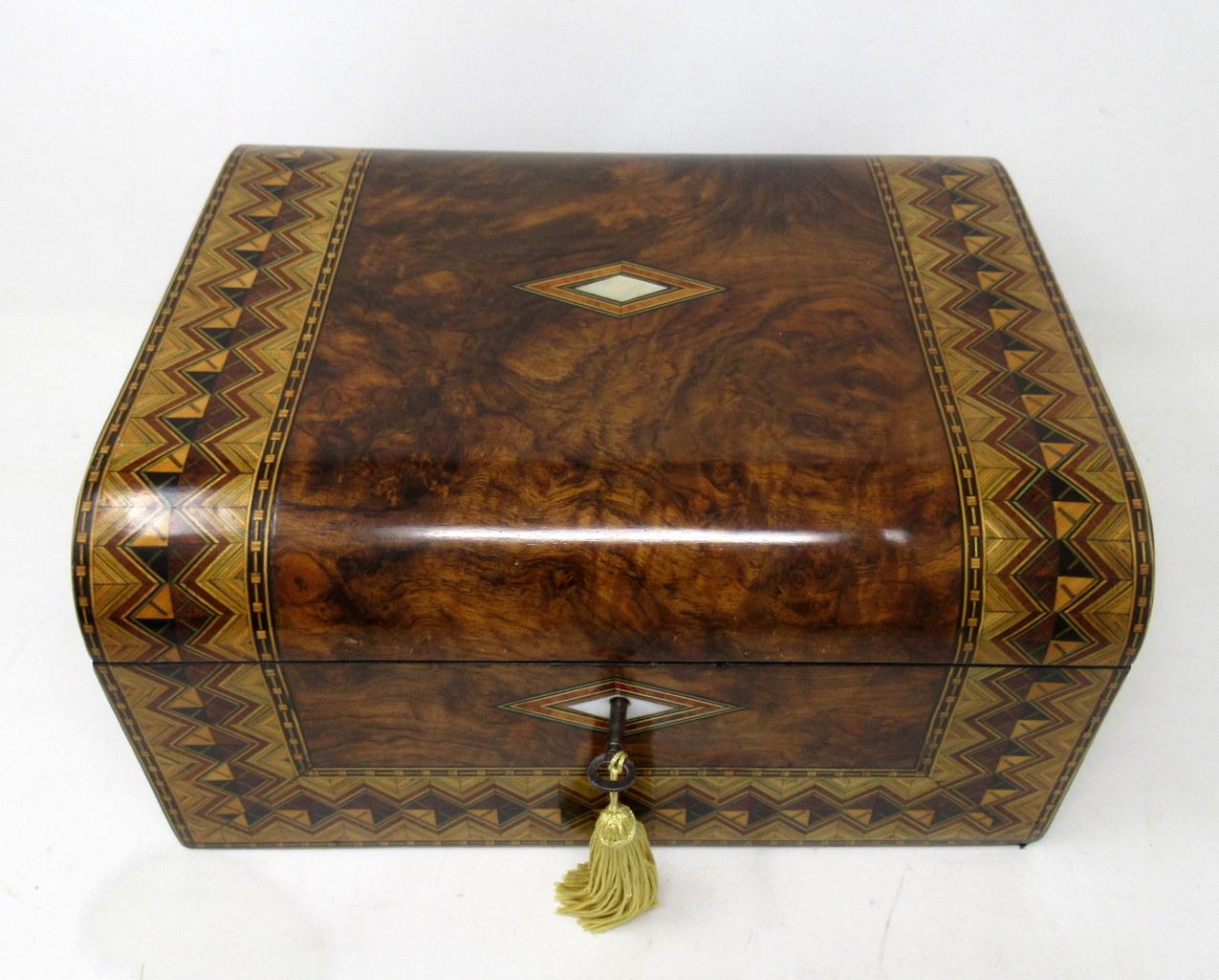 An exceptionally fine quality English tunbridge ware inlaid well figured solid burr walnut ladies or gents travelling writing slope of outstanding quality and compact proportions, Last quarter of the nineteenth century.

The original fitted