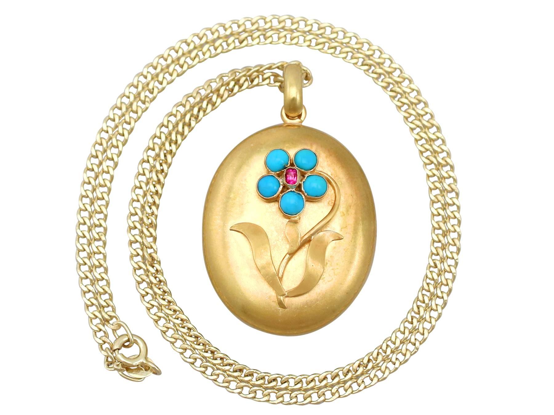 An impressive antique Victorian 1860s 0.95 carat turquoise and 0.04 carat ruby, 22 karat yellow gold locket pendant; part of our diverse antique jewelry and estate jewelry collections.

This fine and impressive antique Victorian locket has been