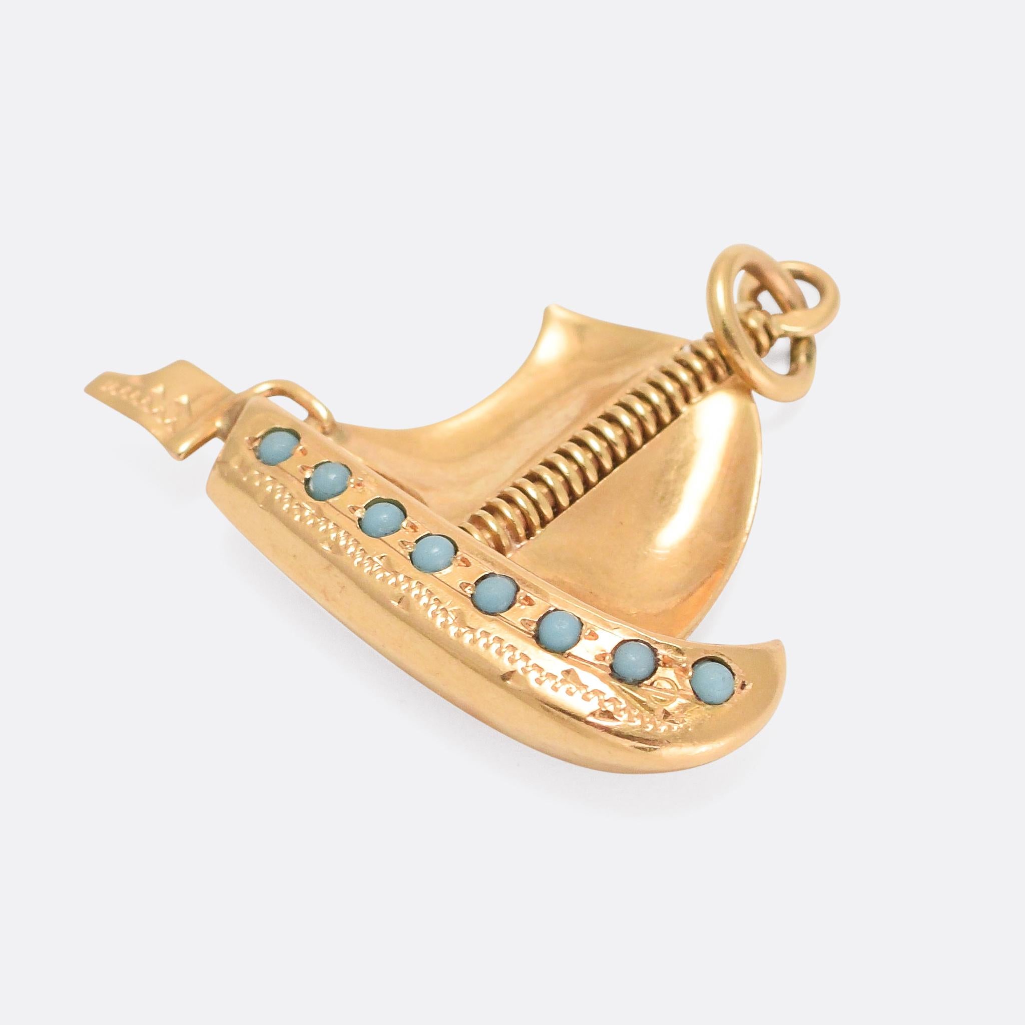 A fine antique boat pendant modelled in high carat and set with turquoise cabochons to the front and back. It's expertly hand crafted, with excellent detailing and textures. With Portuguese hallmarks for 800 grade gold (approx. 19.2 karats)

STONES