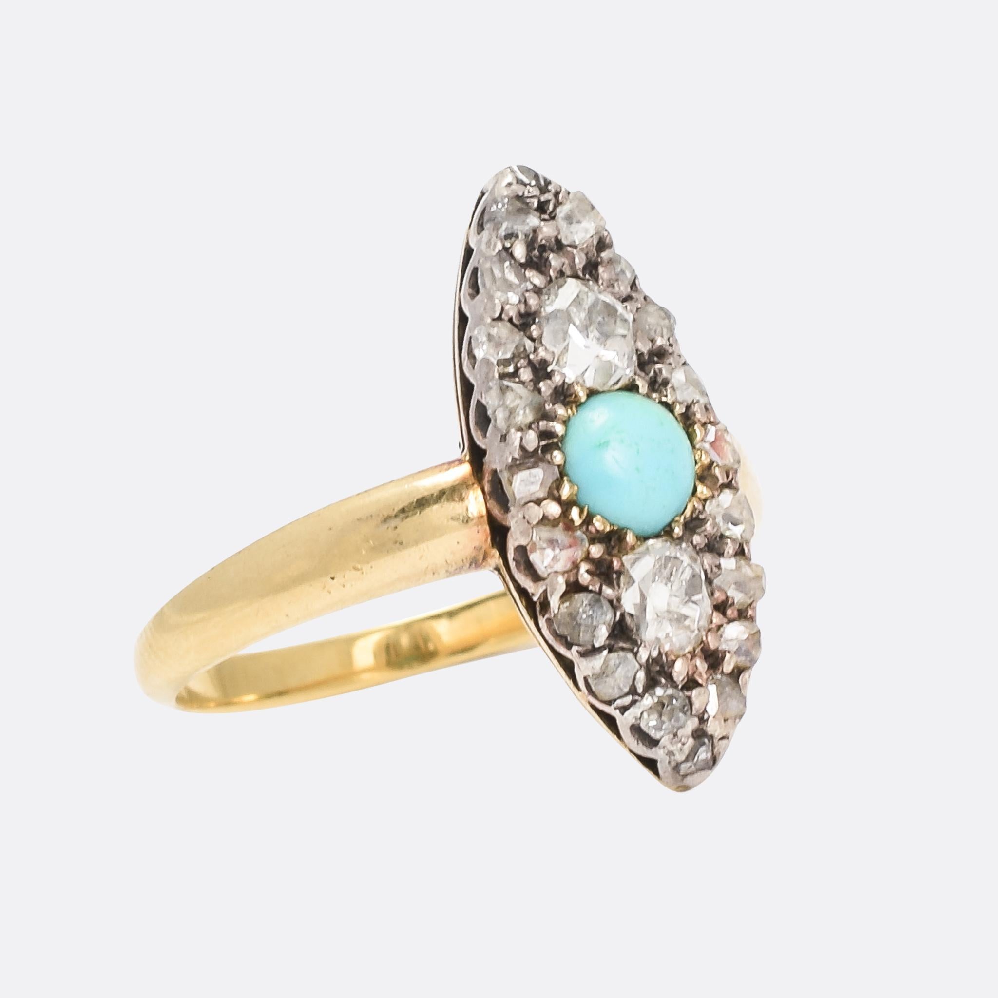 A pretty Victorian Turquoise & Diamond marquise cluster ring dating from the 1880s. The principal turquoise displays excellent colour, flanked by two cushion cut diamonds and set within a cluster of smaller rose cut diamonds. It's finely worked,