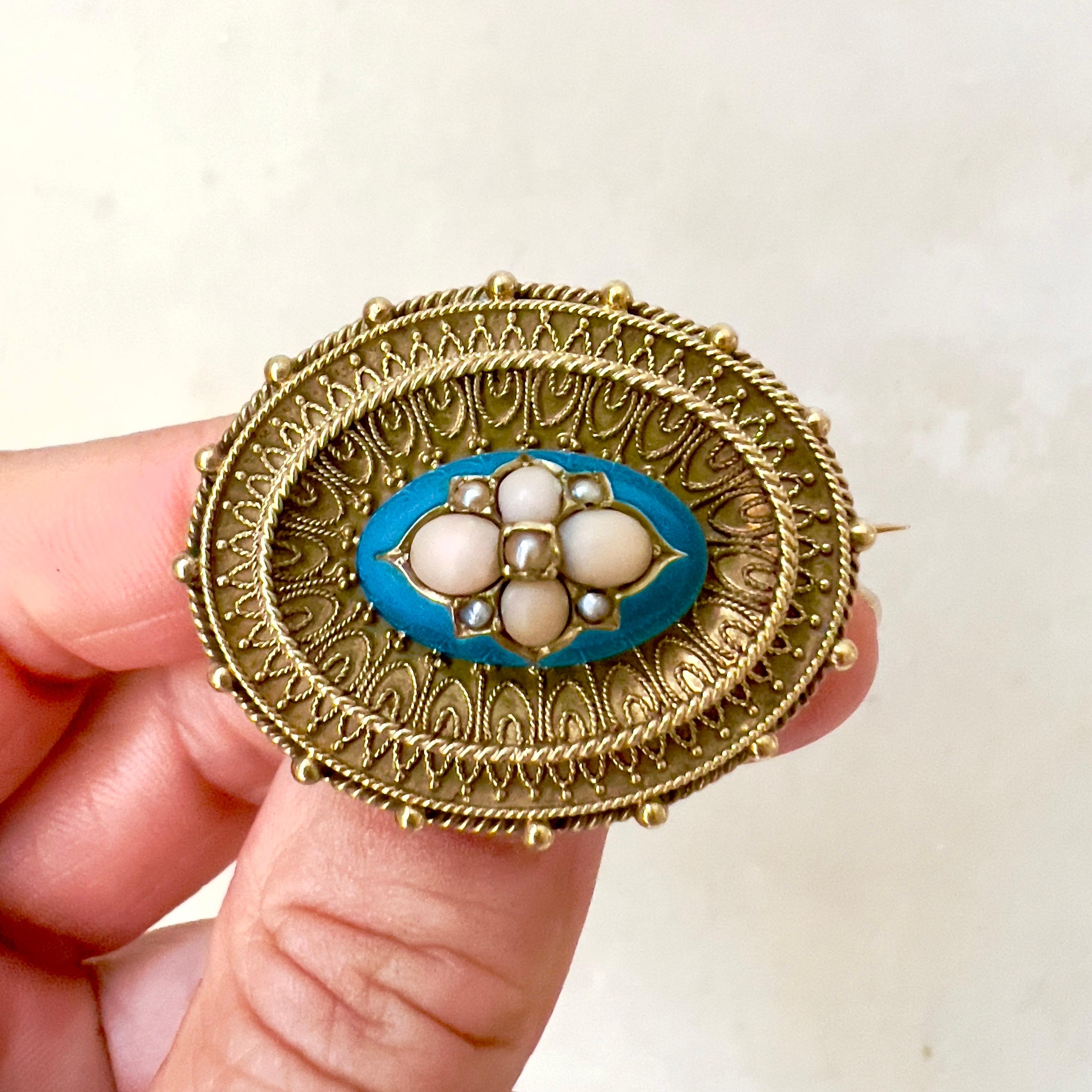 This antique Victorian brooch is a remarkable piece of jewelry that beautifully captures the elegance and intricate craftsmanship of the era, blending various elements to create a piece that is both ornate and rich in historical significance.

The