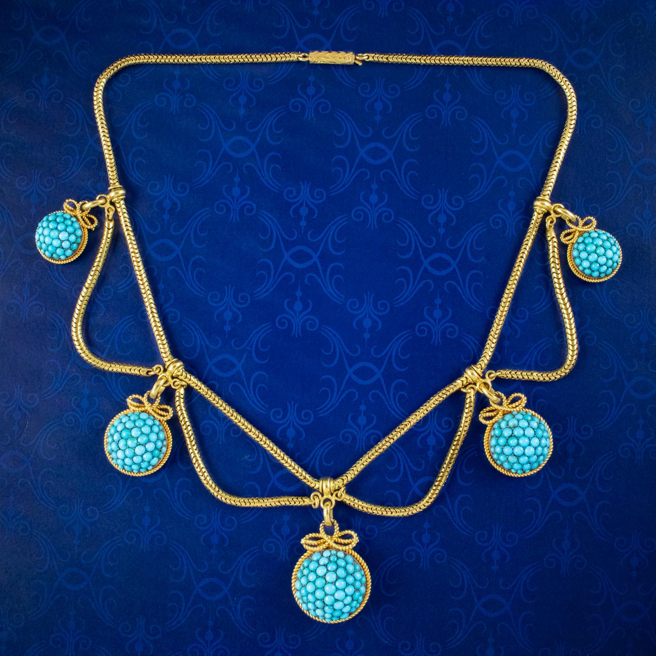 A remarkable antique Etruscan revival collar from the mid-Victorian era (Circa 1860). The piece consists of an articulated, 15ct gold snake chain which is silky smooth and decorated with chain festoons between five domed droppers, each encrusted