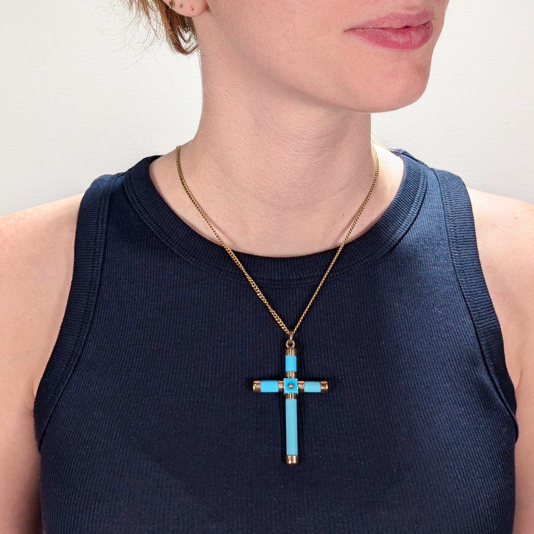 A fine Victorian pendant cross.

Comprised of turquoise colored glass rods and buttons fitted with gold-filled findings and terminals.

The top terminal fixed with a bail and jump ring.

Simply a wonderful Victorian cross!

(Chain for display