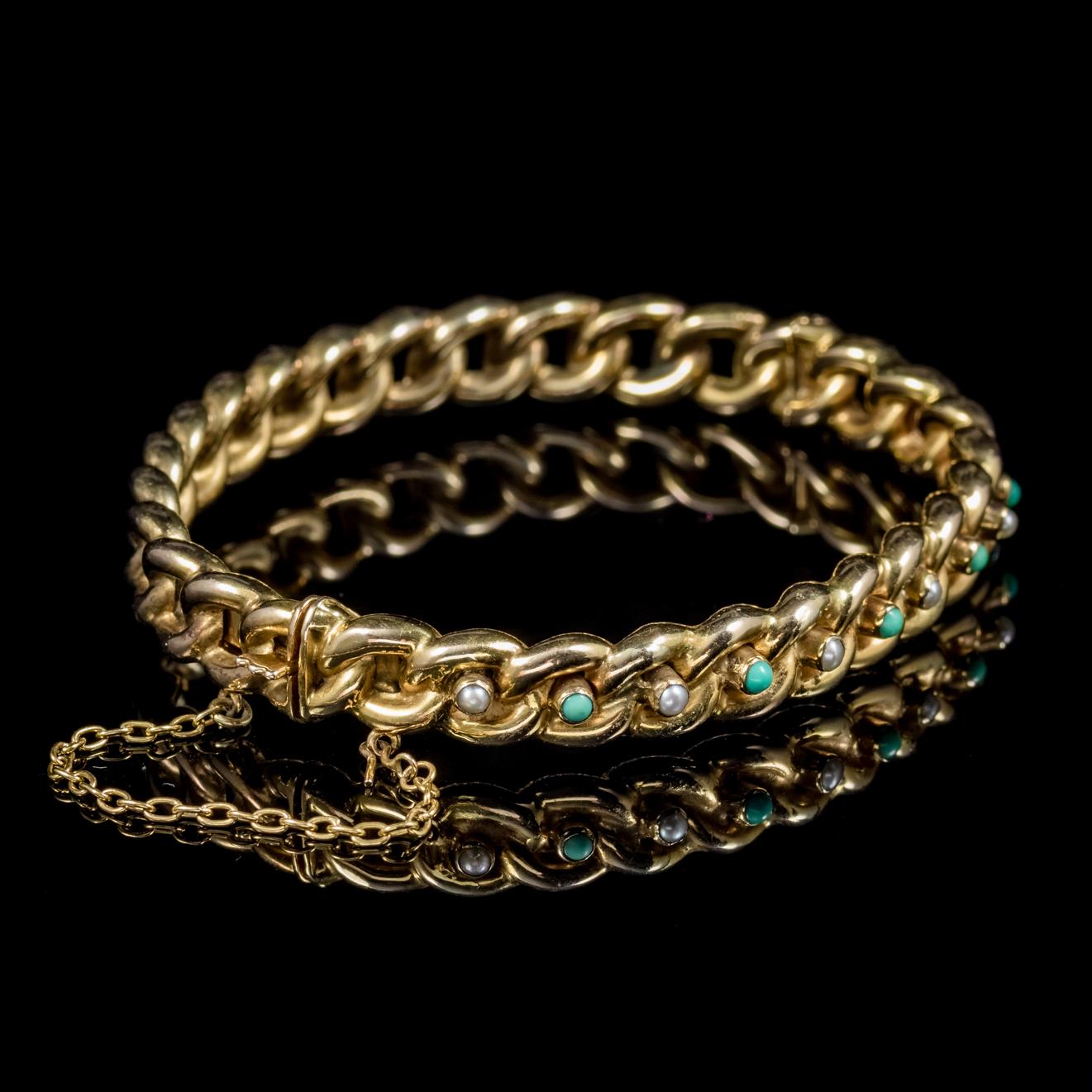 A fabulous antique Victorian Turquoise and Pearl bangle dated 1889.

Set with interchanging Turquoise and Pearls across the front in a lovely 15ct Yellow Gold chain link setting. 

Turquoise stones are considered a symbol of friendship and were once