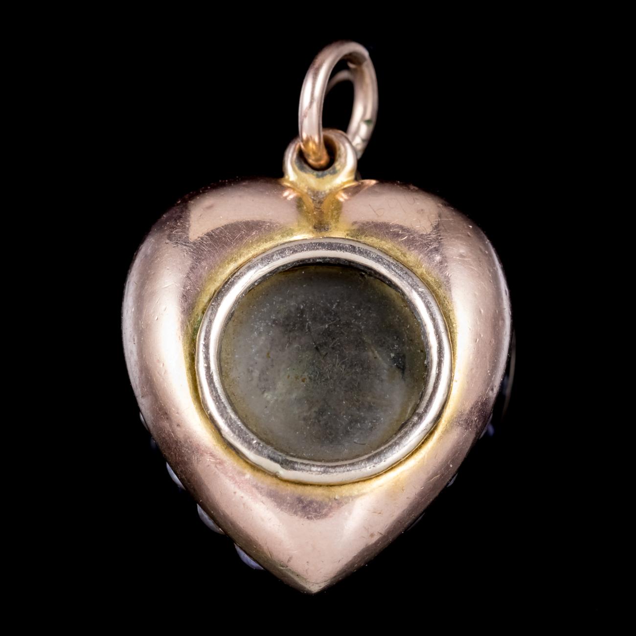 A delightful antique Victorian heart pendant decorated with borders of Pearls and Turquoise stones which graduate out from the centre. Turquoise are a lovely opaque stone with a calming blue/ green colour that was considered a symbol of friendship