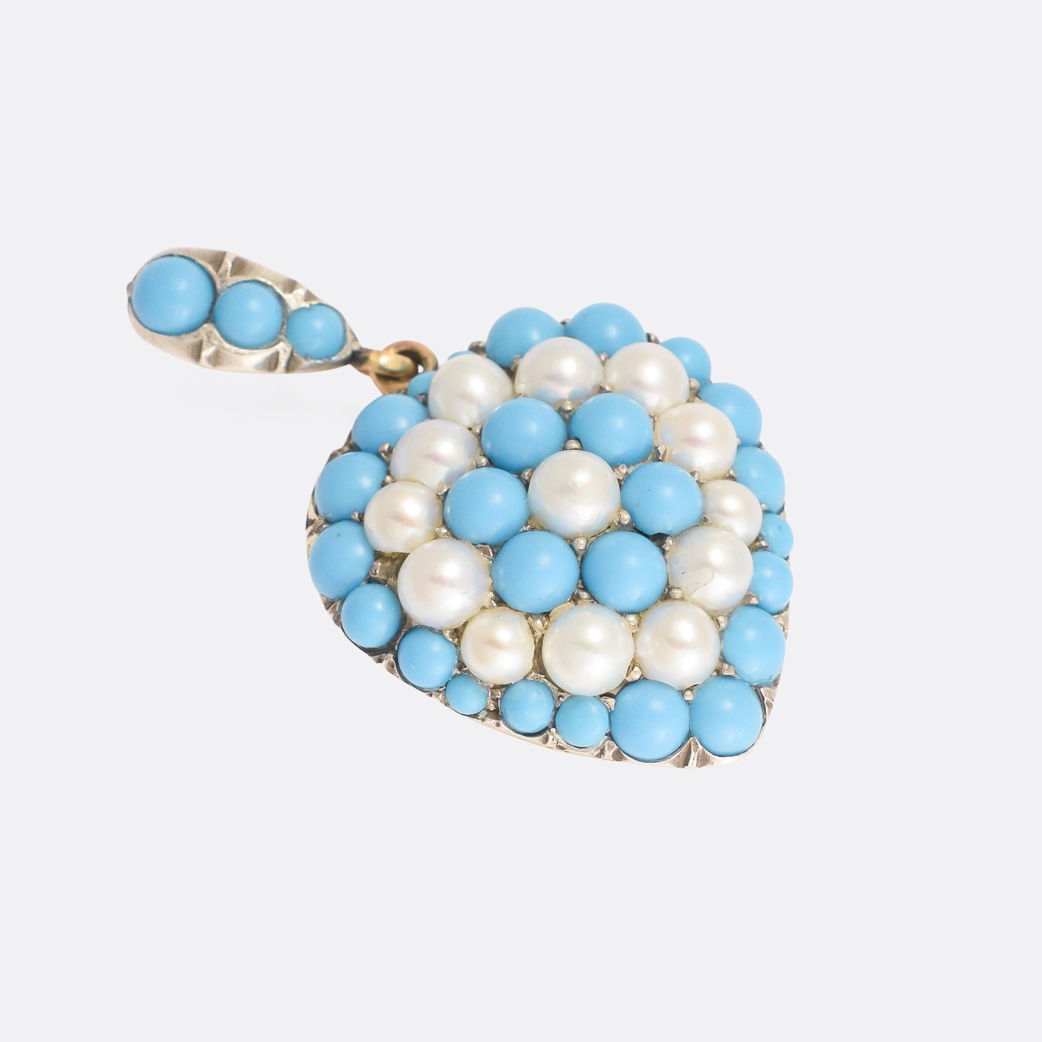 A particularly lovely Victorian puffed heart pendant, fully pavé set with alternating rings of vibrant Persian turquoise and natural pearls. It's modelled in 15k yellow gold with silver settings, and dates from the late 19th Century - circa 1880.