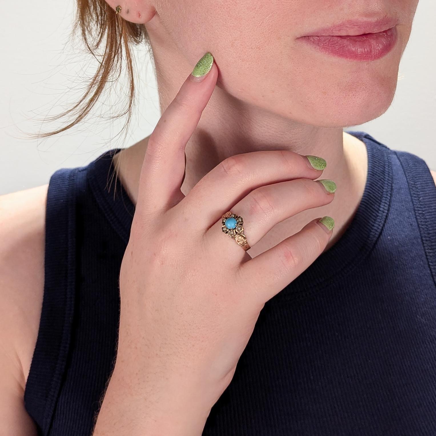 A fine antique Victorian ring.

In 10k rose gold with engraved decoration to the shoulders.

With a prong set turquoise cabochon to the center and 6 small seed pearls around the circumference of the head.

Simply a wonderful antique