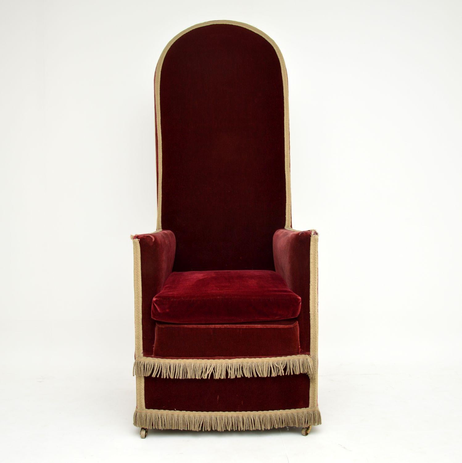 This antique Victorian high back armchair has a very high back, which is hard to visualize in the images, so double check the measurements. It has a very grand, almost throne like look & could have been used for something ceremonial.

This chair