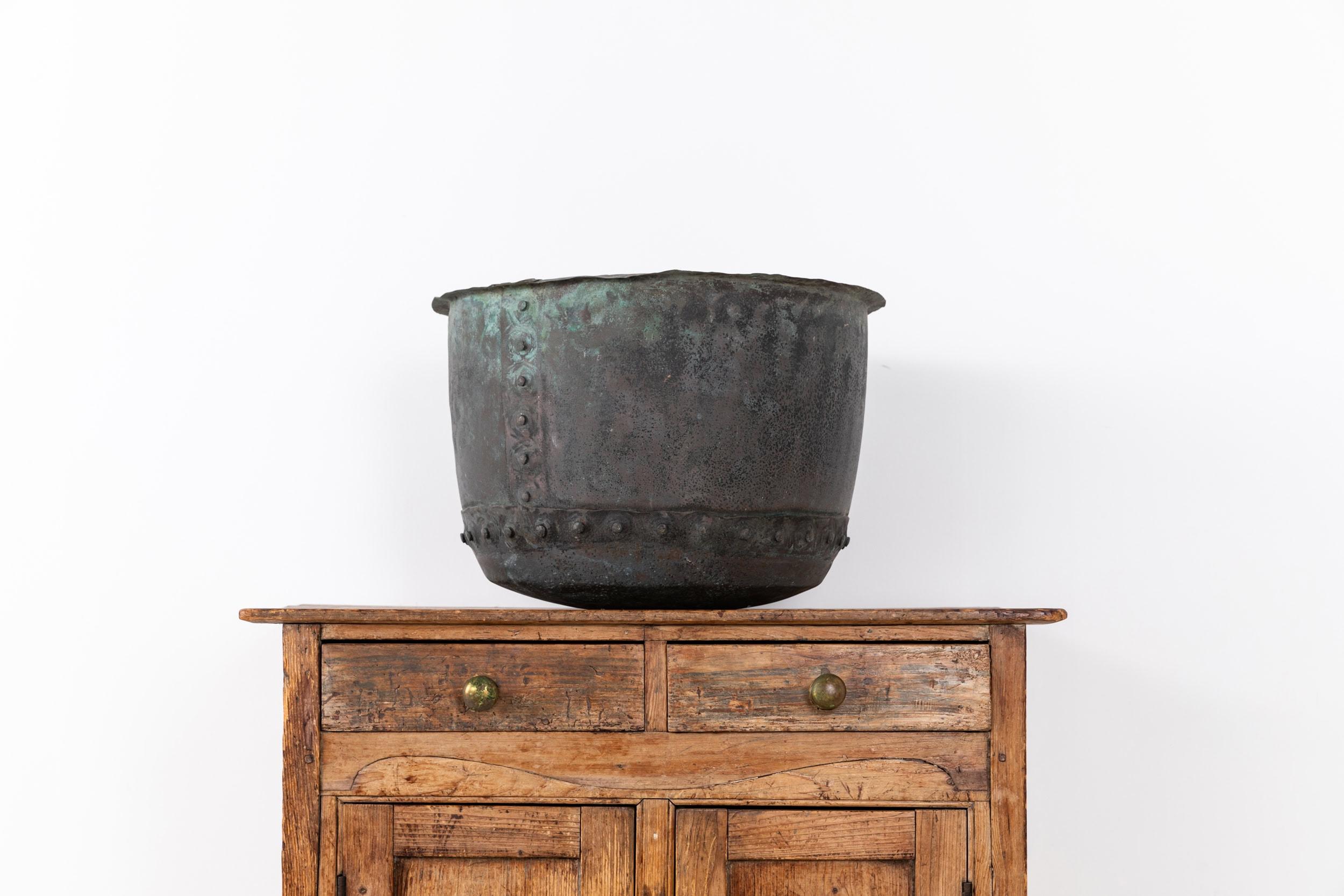 A wonderful antique rivetted copper boiler pot. c.1880

Great size and shape with the most perfect natural verdigris patina that only time can produce. Ideal size for storing fireside logs or as a planter.

