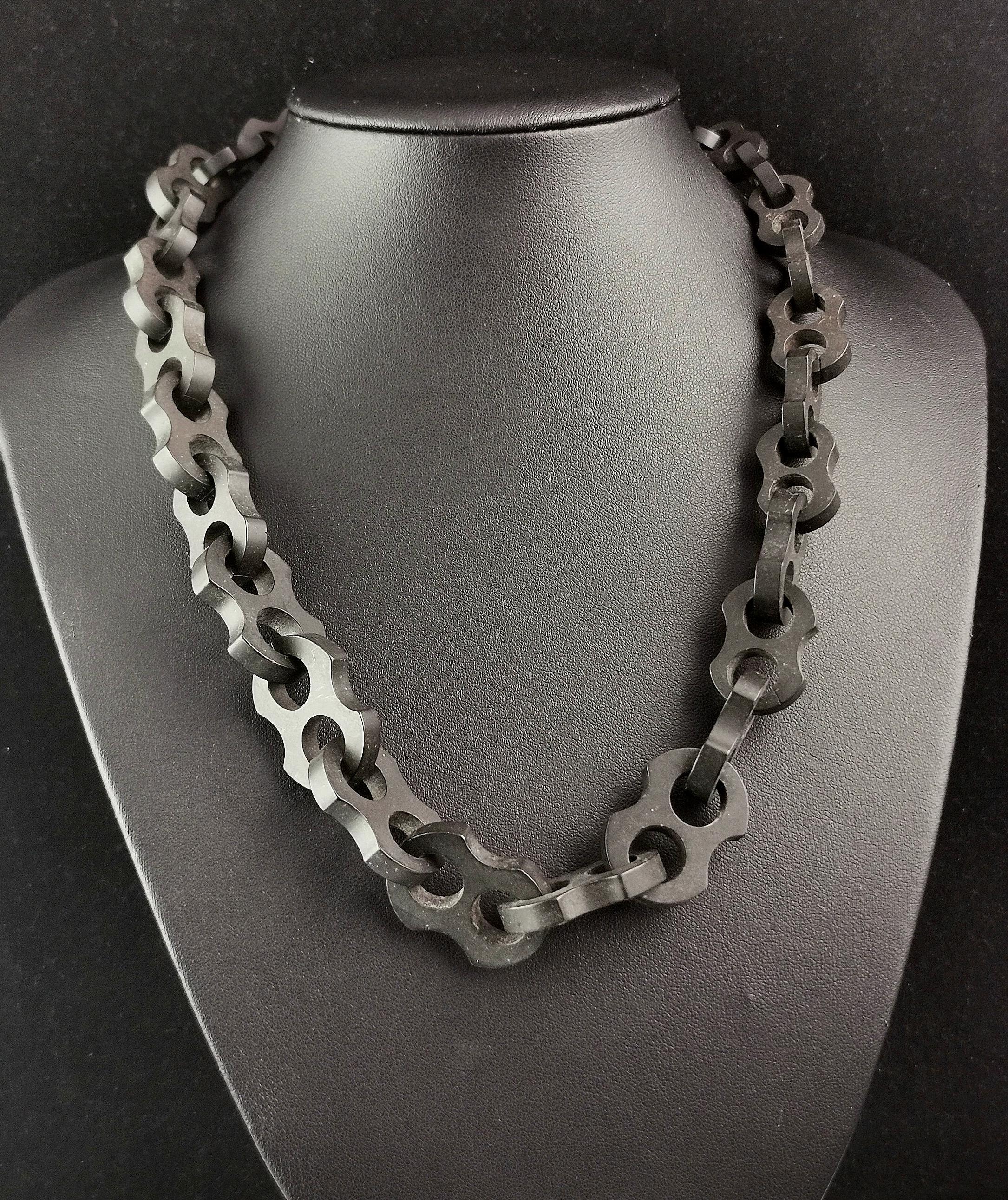 An attractive and unusual antique Victorian Vulcanite chain necklace.

The necklace features large, chunky, fancy mariner style Links, interlocking along the length and it fastens with a black lacquered hook fastener so could double up as a watch /