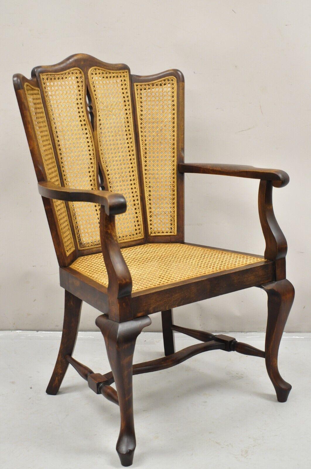 Antique Victorian Walnut and Cane Carved Lounge Arm Chair With Queen Anne Legs. Circa Early 1900s. Measurements: 38.5
