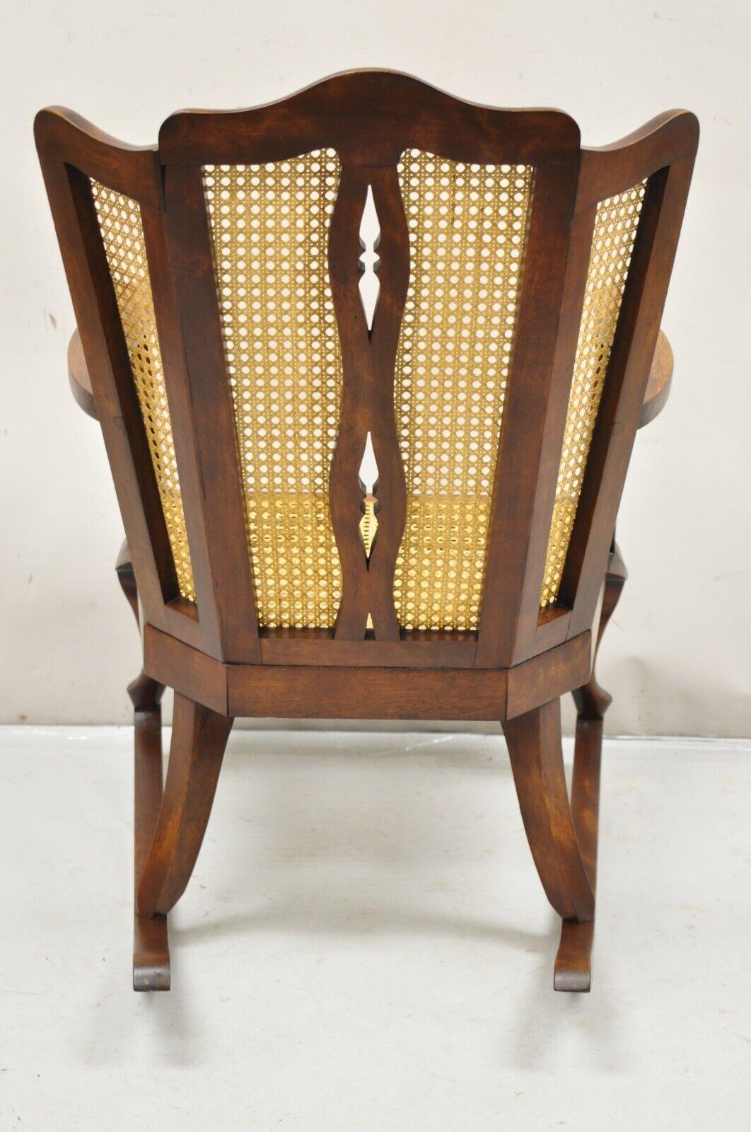 Early 20th Century Antique Victorian Walnut and Cane Carved Rocker Rocking Chair Queen Anne Legs For Sale