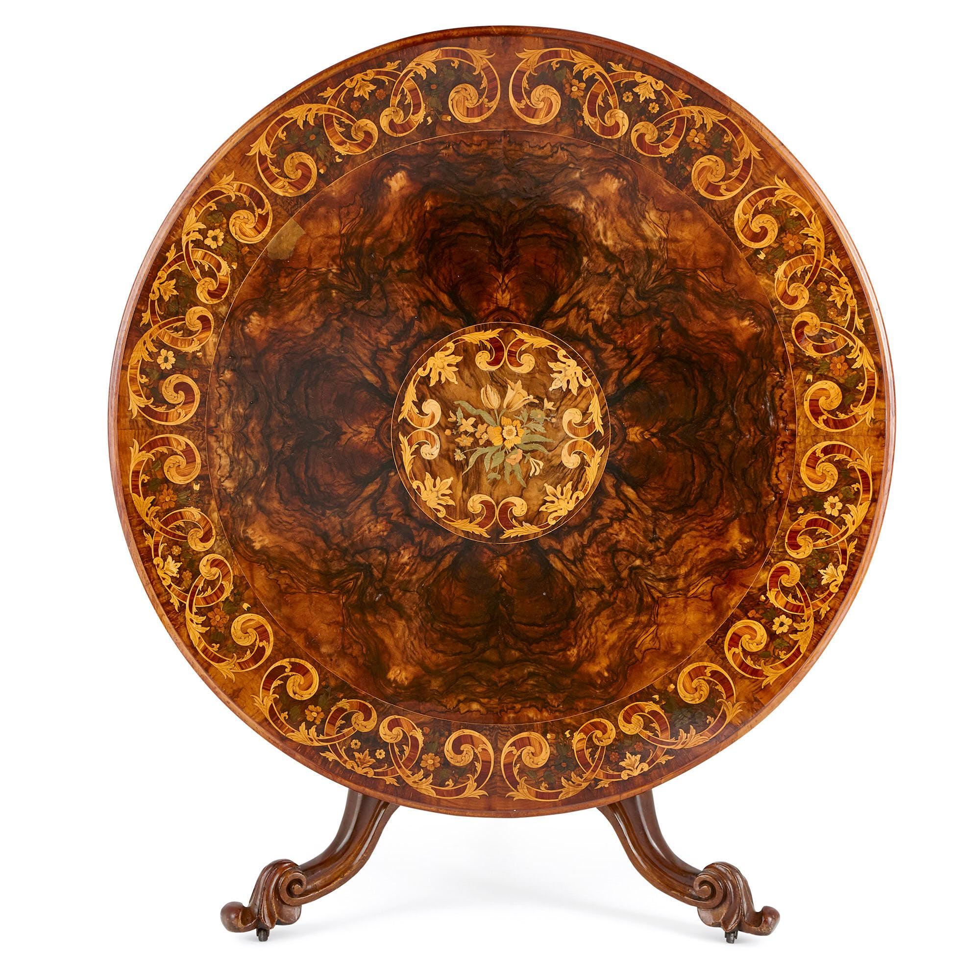 This wonderful breakfast table was crafted in England in circa 1870, during the reign of Queen Victoria.

The item is notable for its large circular top which is decorated with beautiful marquetry work. This includes a central medallion which