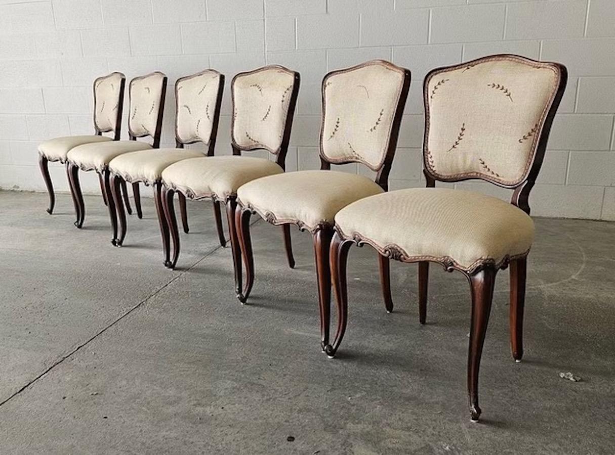 Antique Victorian Walnut Dining Chairs – Set of 6

Elegant set of six hand-carved walnut dining chairs in the Louis XV style. Each chair features beautifully contoured cabriole legs, carved detailing along the seat frame, and an upholstered backrest