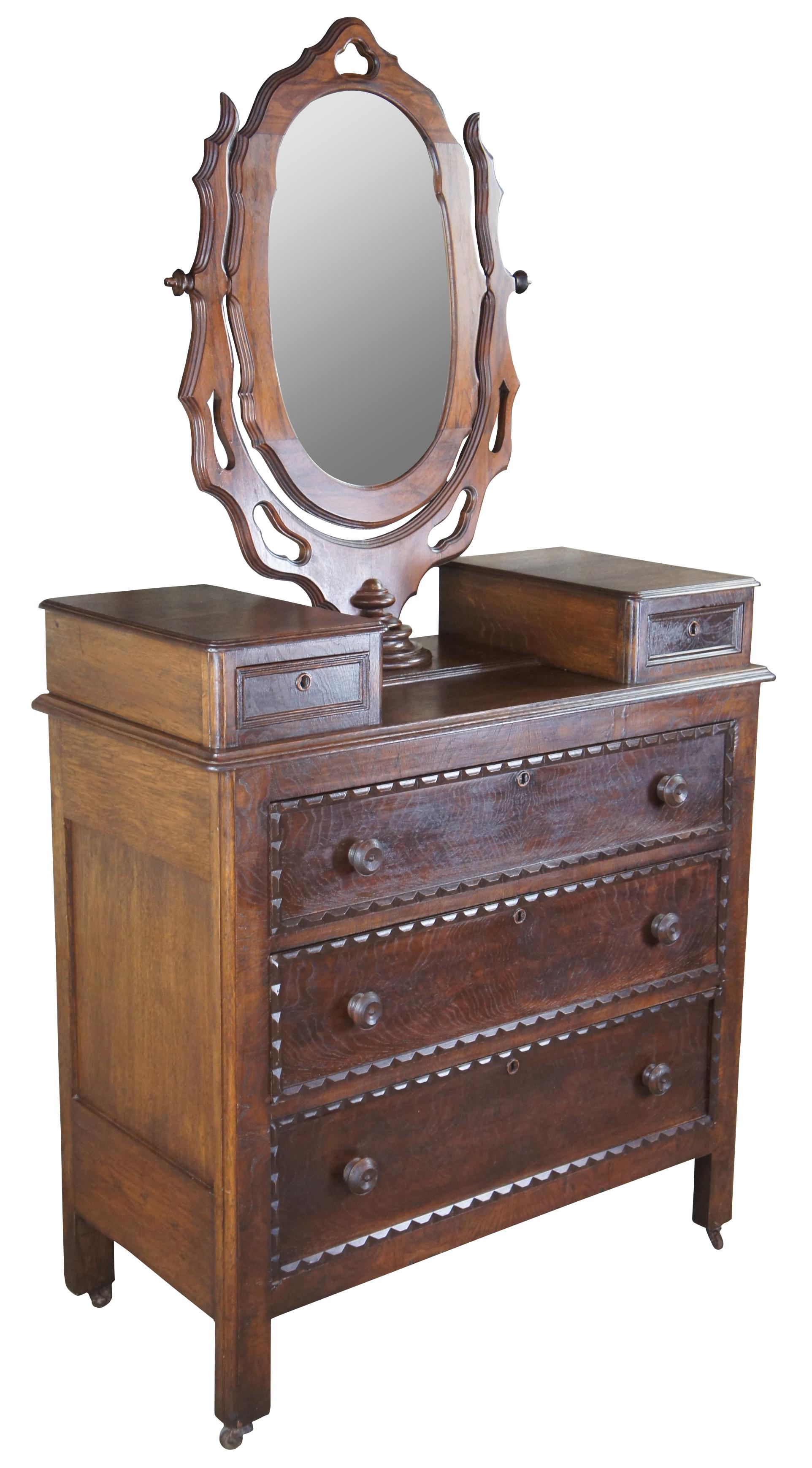 Antique Victorian mirror top dresser, circa 1880s. Made of walnut featuring ornate styling with carved ornate swivel mirror, three full sized drawers and two upper glove box drawers.

Measures: 18.5