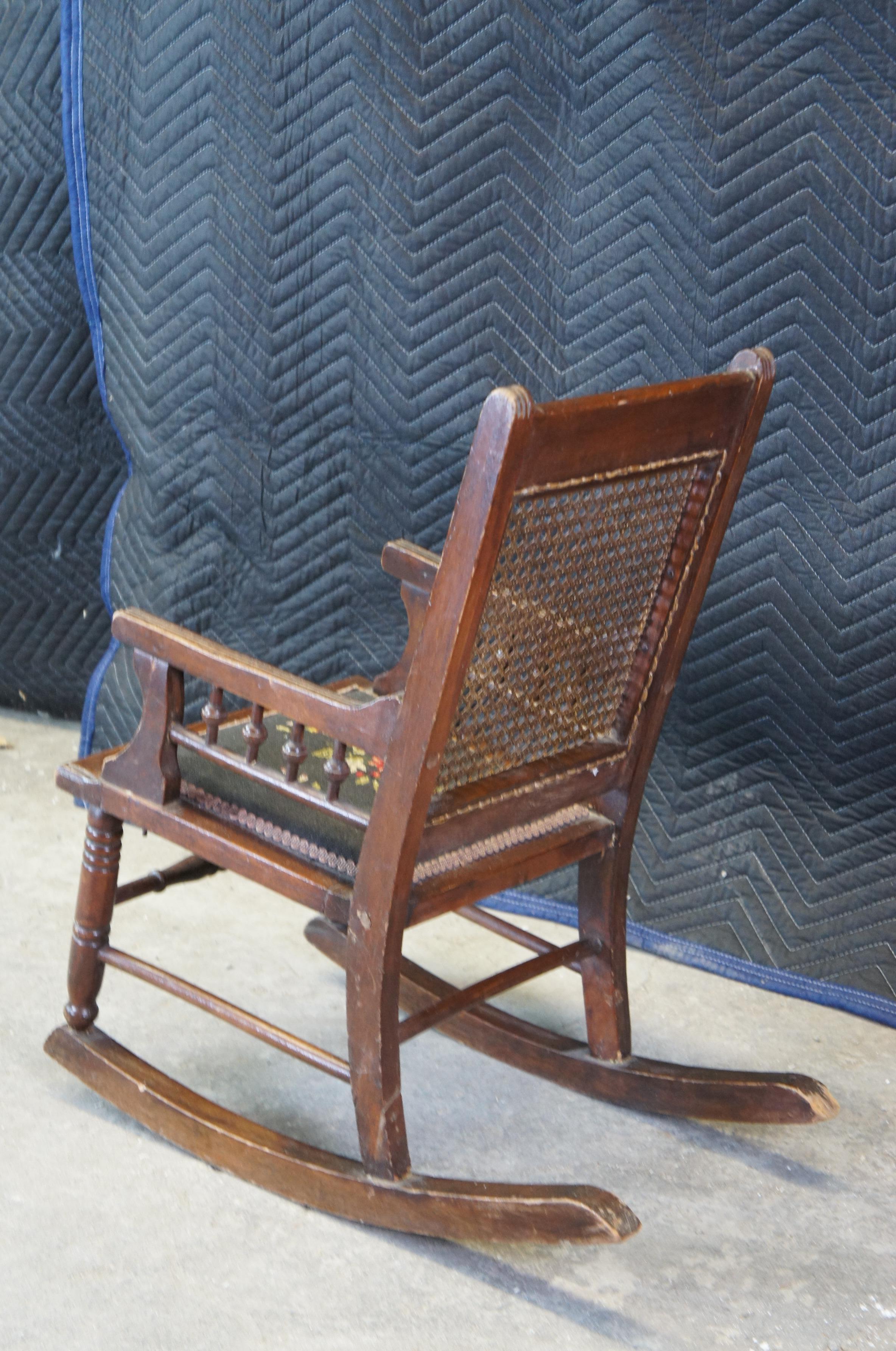 Antique Victorian Walnut Eastlake Childs Caned Needlepoint Rocking Arm Chair In Good Condition In Dayton, OH