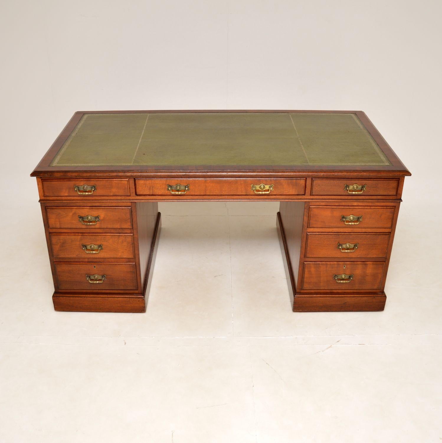 A fantastic antique Victorian partners desk in solid walnut. This was made in England, it dates from around 1880-1900.

The quality is outstanding, this is a large and impressive item. The inset green leather top has a gorgeous colour tone and is