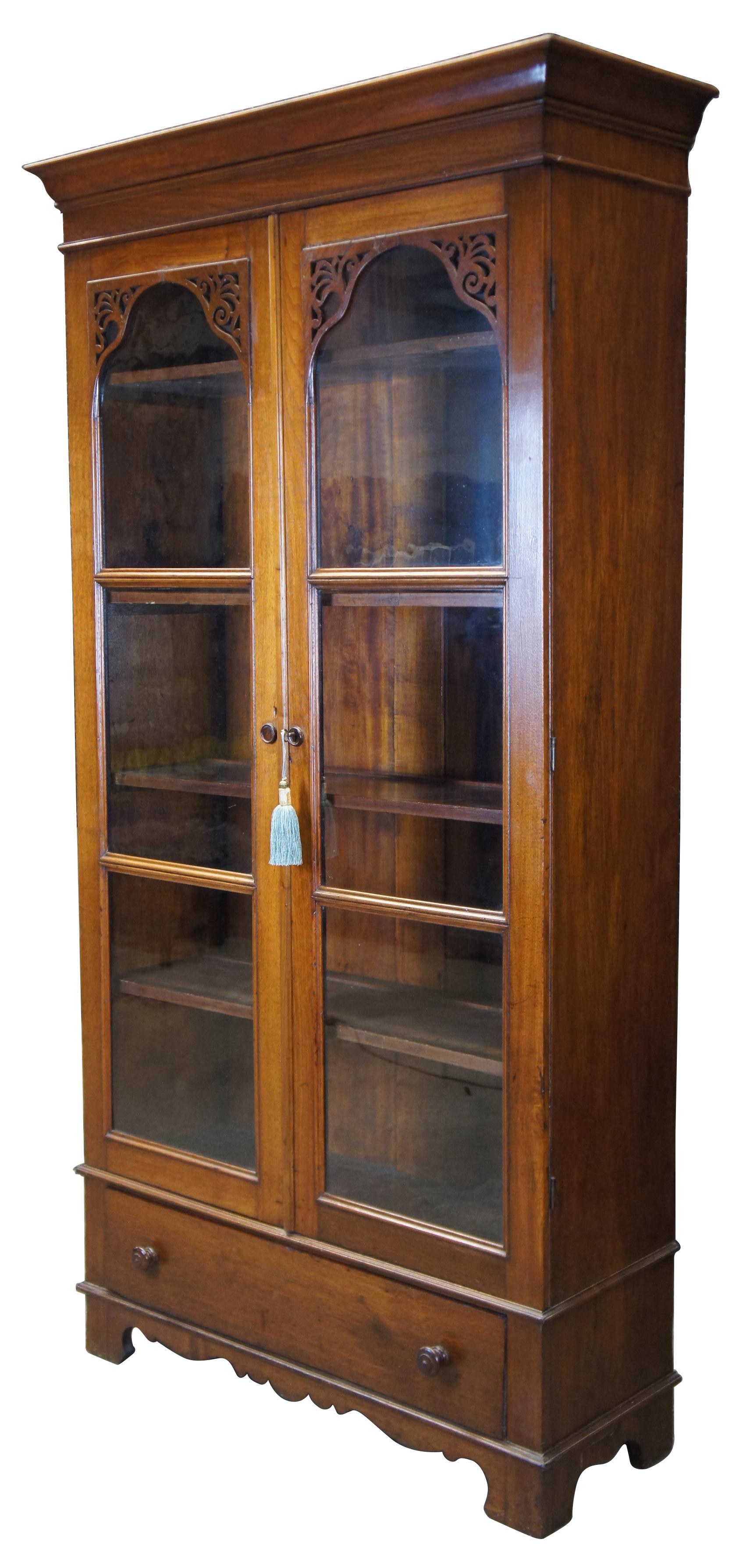 antique library cabinet with glass doors