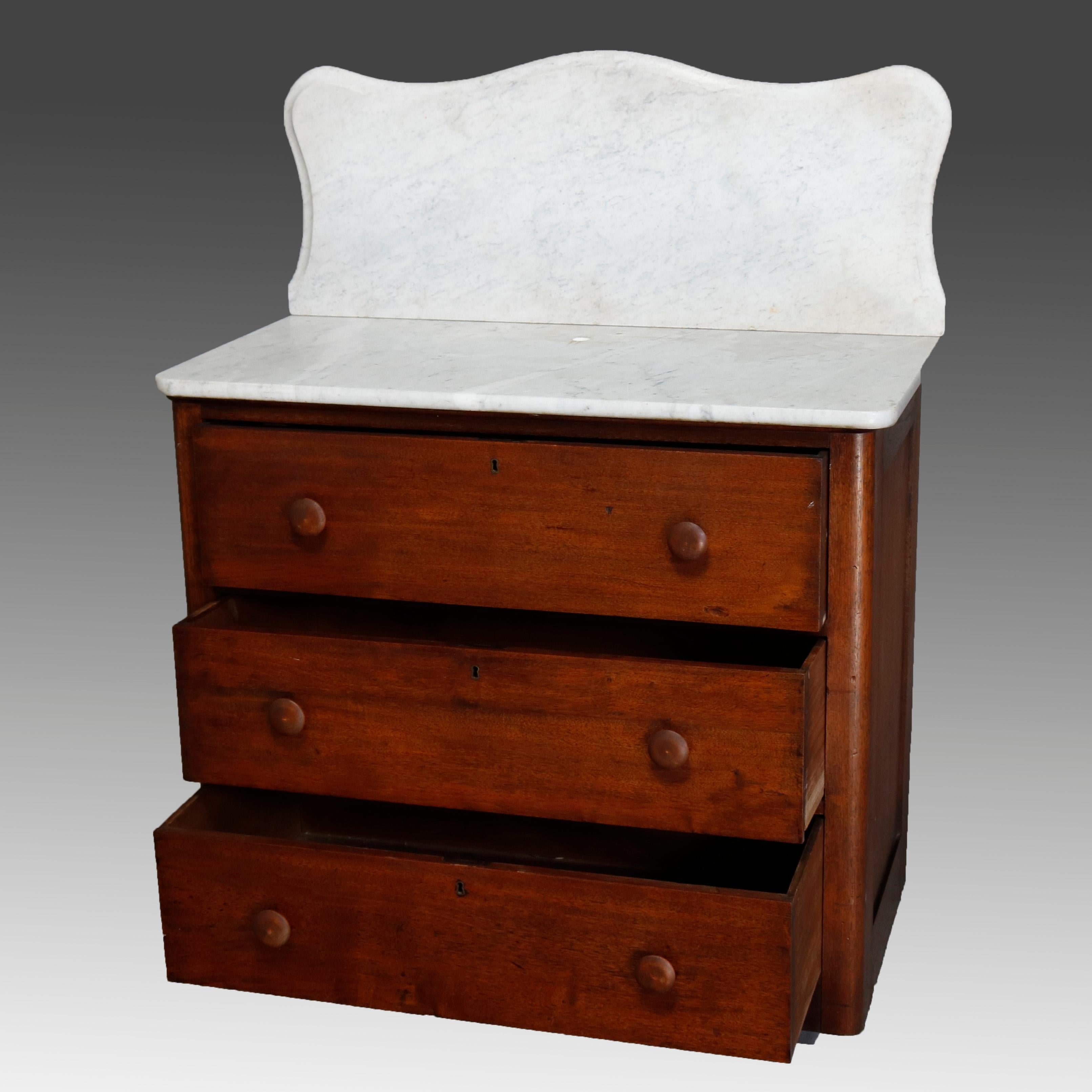 An antique Victorian chest offers marble top with shaped and beveled backsplash surmounting case having three long drawers, circa 1890

***DELIVERY NOTICE – Due to COVID-19 we are employing NO-CONTACT PRACTICES in the transfer of purchased items. 