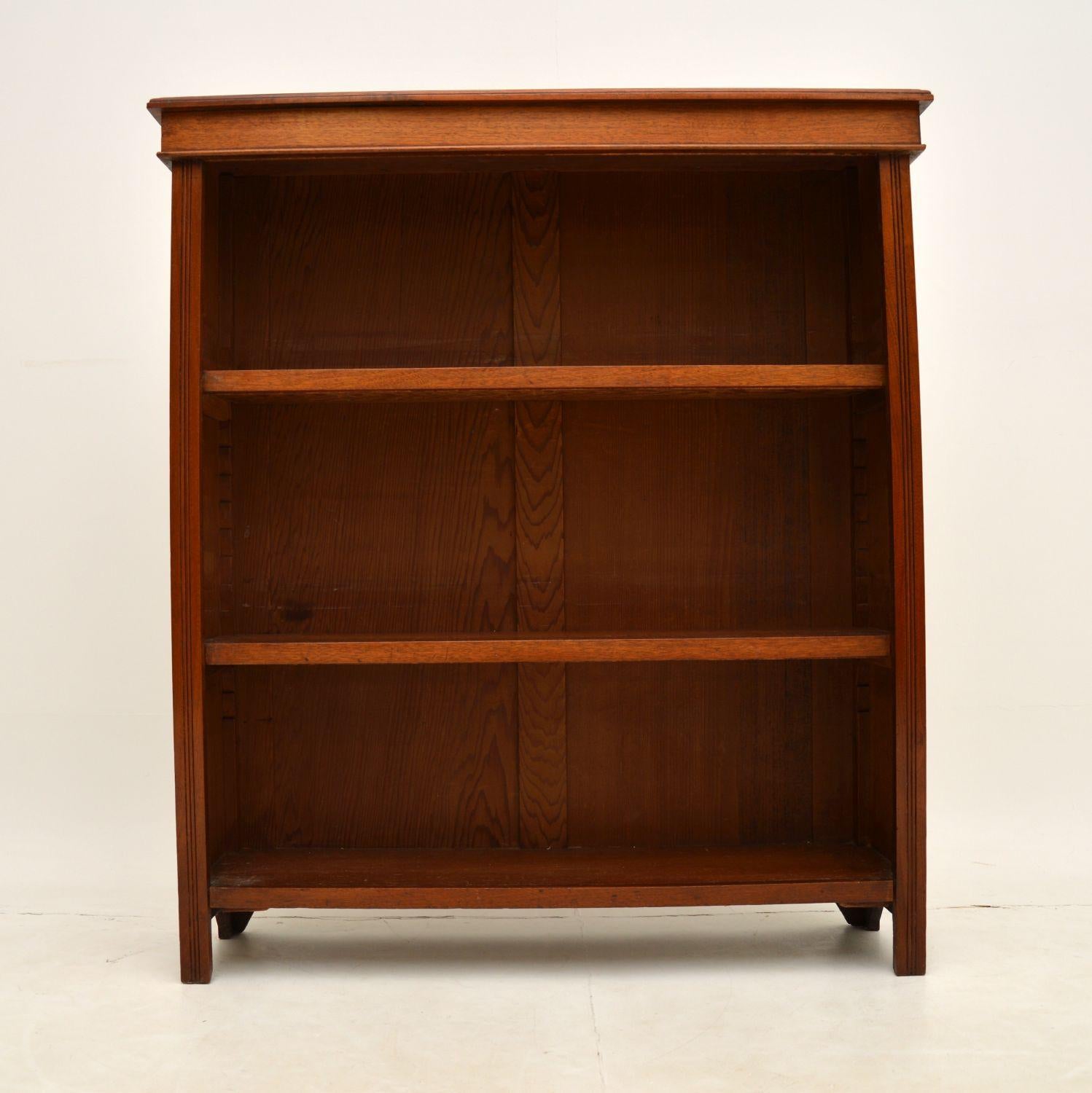 A smart and useful antique Victorian open bookcase in solid walnut. This was made in England & it dates from around the 1880-1890’s period.

The quality is excellent and this is a lovely size. It has two removable shelves that can be adjusted with