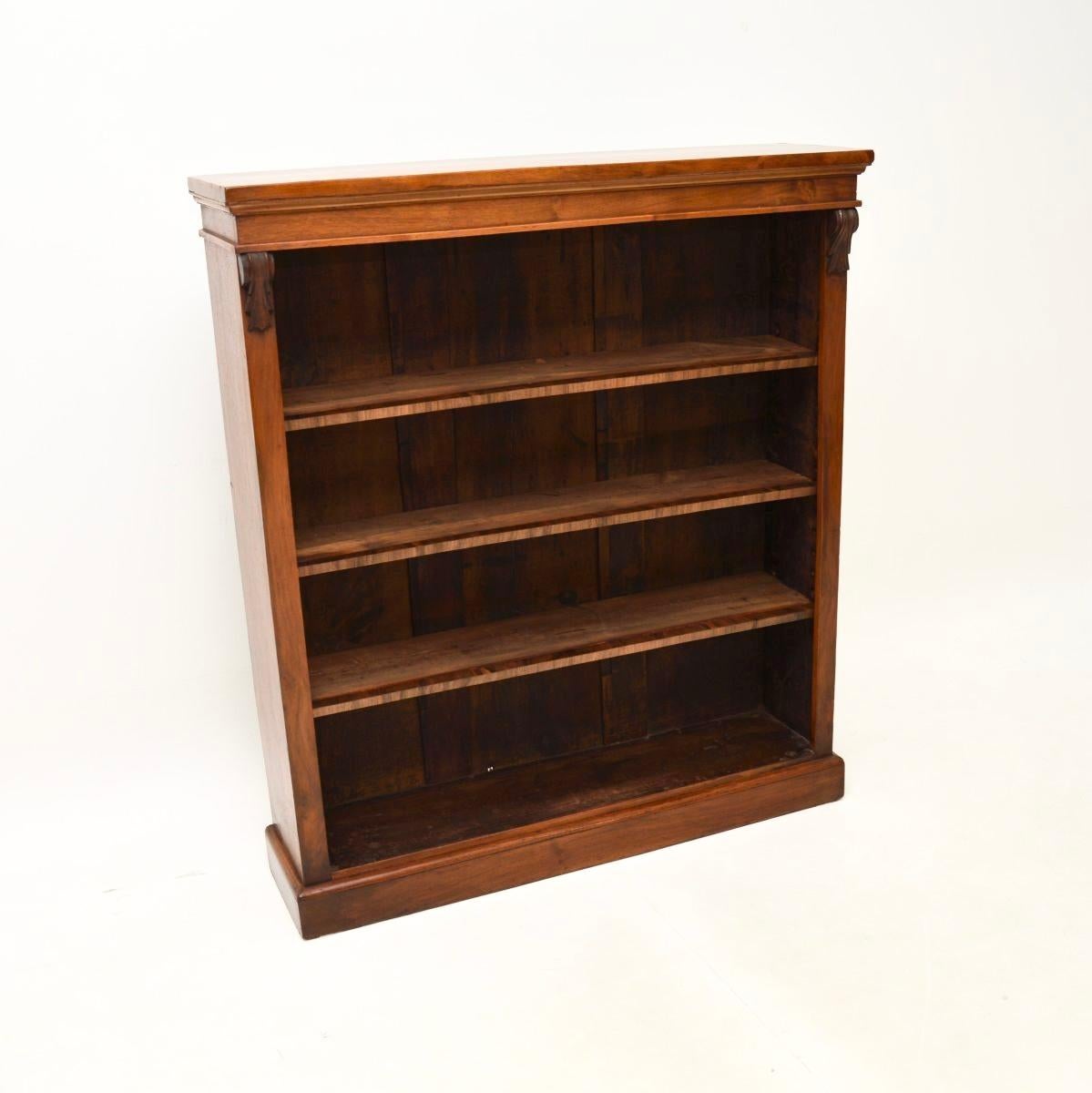A smart and very well made antique Victorian walnut open bookcase. This was made in England, it dates from around the 1860-1880 period.

The quality is great, this sits on a plinth base, with adjustable shelves and lovely carved corbels beneath the