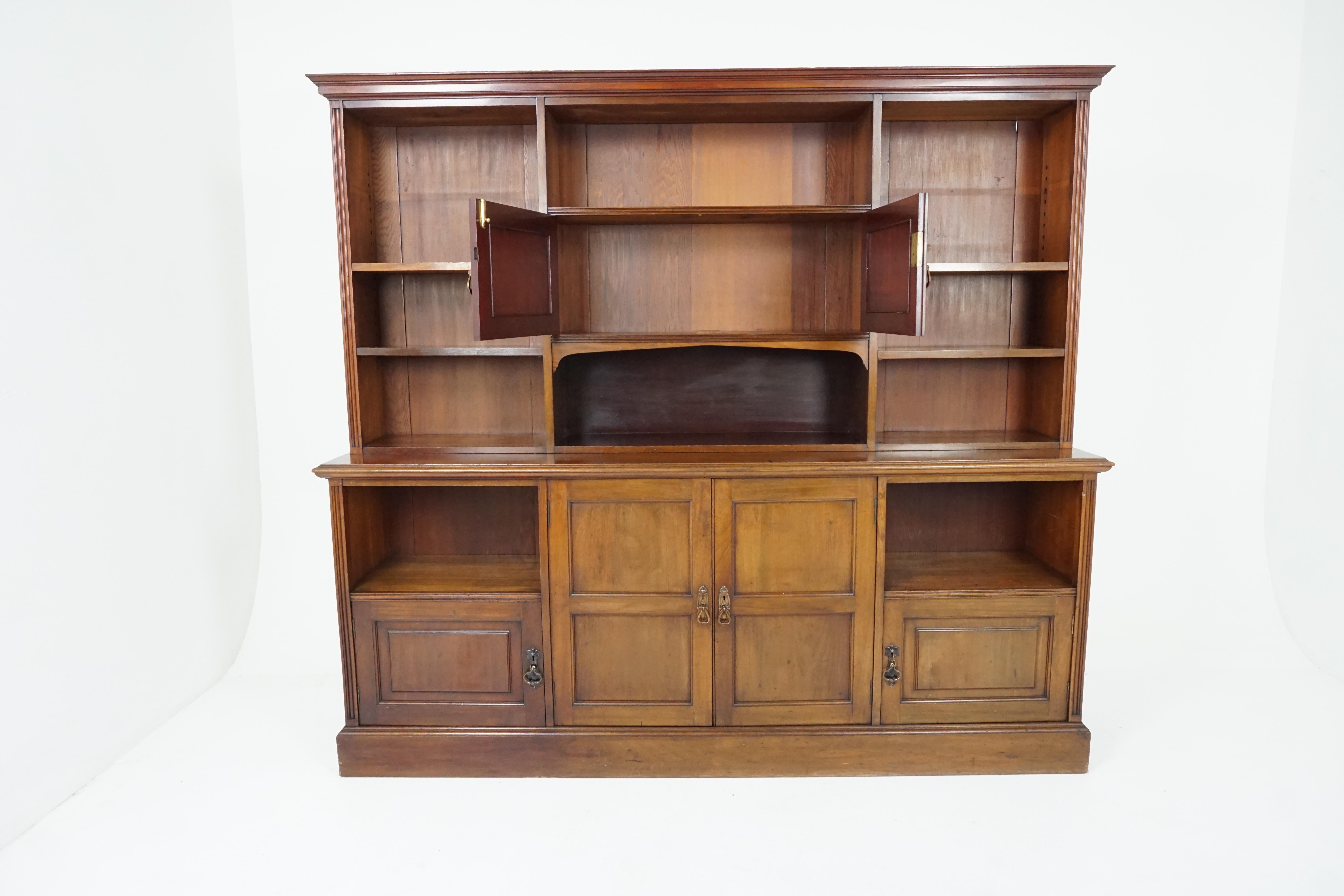 Antique Victorian walnut open bookcase, Scotland 1875, H519

Scotland 1875
Solid walnut
Original finish
Overhanging cornice
Open bookcase underneath
Two paneled doors in the center
Base has two paneled doors that open to reveal single shelf, with