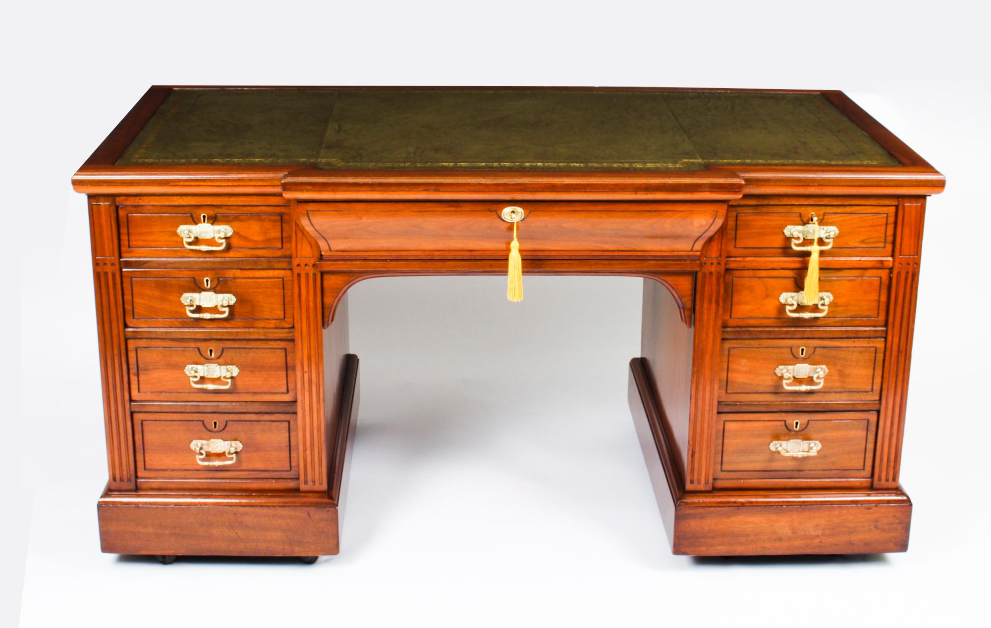 This is a beautiful antique Victorian walnut pedestal desk, bearing the makers impressed stamp, 