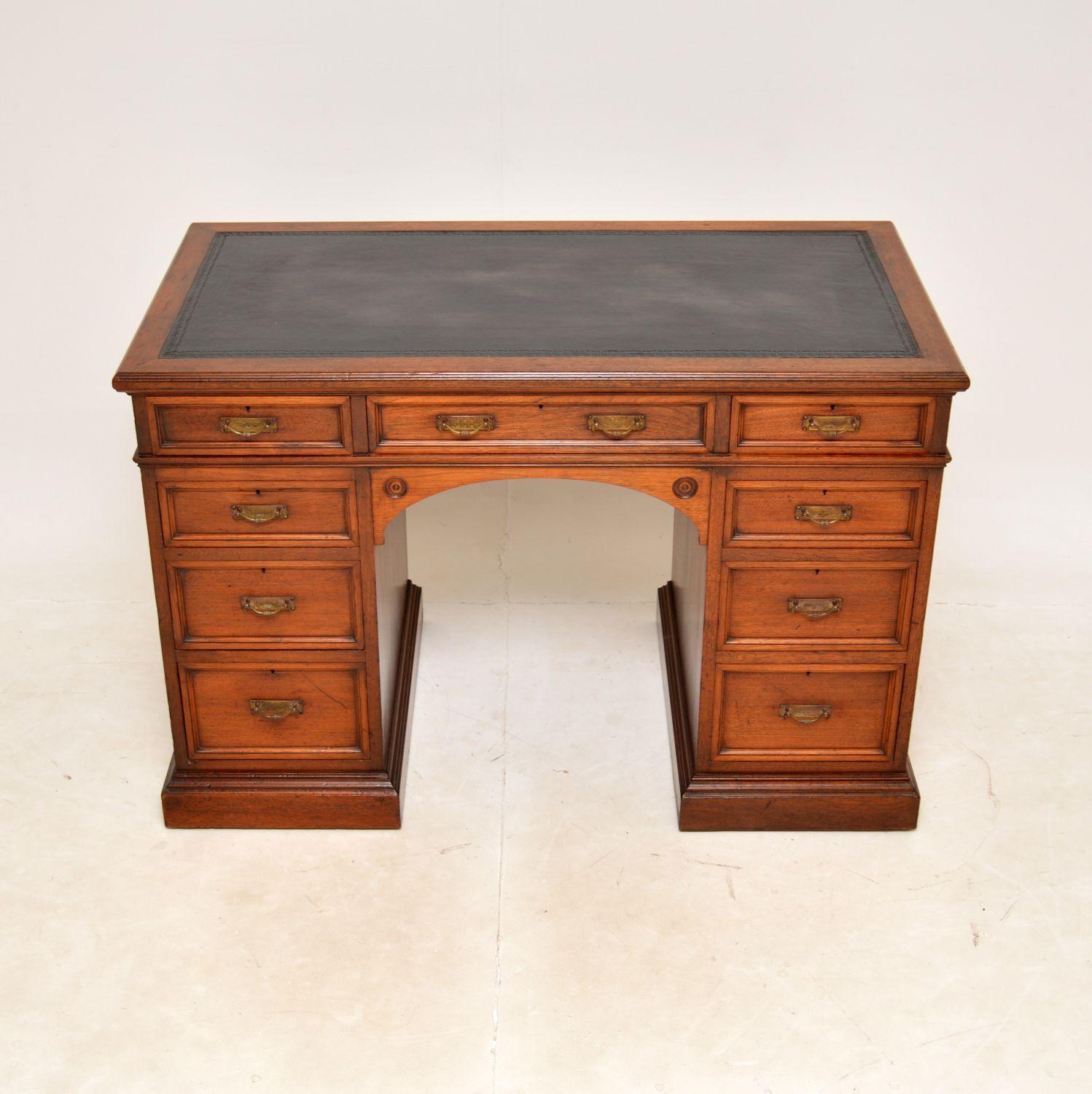 A top quality antique Victorian solid walnut desk by renowned cabinet makers Howard & Sons. This was made in England, it dates from around the 1870-1890 period.

It is extremely well made and is a useful, fairly petite size. There are lovely